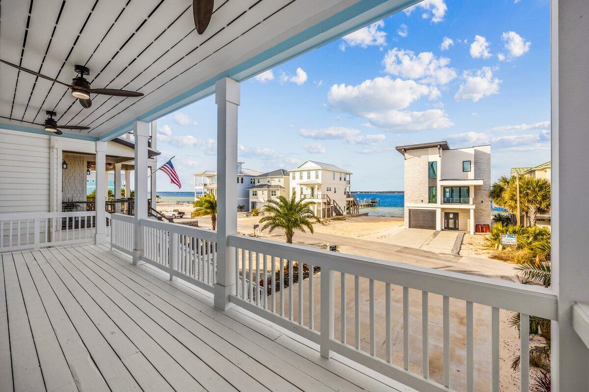 Discover coastal living just moments from the pristine shoreline of Navarre Beach and the breathtaking beauty of Gulf Islands National Seashore. 
Experience the best of Florida's Emerald Coast in this beautifully designed, newly constructed 6-bedroom, 5-bathroom beach home, thoughtfully crafted for comfort, durability, and effortless coastal living. Whether you're seeking a full-time residence, a vacation getaway or a high-performing short-term rental investment, this exceptional property checks every box. Built on a Helical Piles/Piers foundation, this home offers enhanced structural stability and long-term durability. Inside, you'll find a bright, open-concept layout filled with natural light and coastal-inspired finishes throughout. The  living and dining areas flow  into a modern kitchen, creating the perfect space for entertaining large groups. Two primary suites provide flexibility for multi-generational living or hosting guests in comfort and privacy. Designed with both relaxation and recreation in mind, the home features: A private elevator for easy access to all levels, a dedicated game room for endless entertainment, a swim spa ideal for year-round enjoyment Offered fully furnished with the golf cart and swim spa, this turnkey property allows you to start enjoying--or renting--immediately. With no HOA restrictions, you'll have greater freedom and flexibility for personal use or short-term rental opportunities. Located near sugar-white sands, emerald waters, and the protected natural beauty of the national seashore, this stunning Navarre Beach home is where modern luxury meets laid-back coastal charm. Your beach lifestyle begins here.