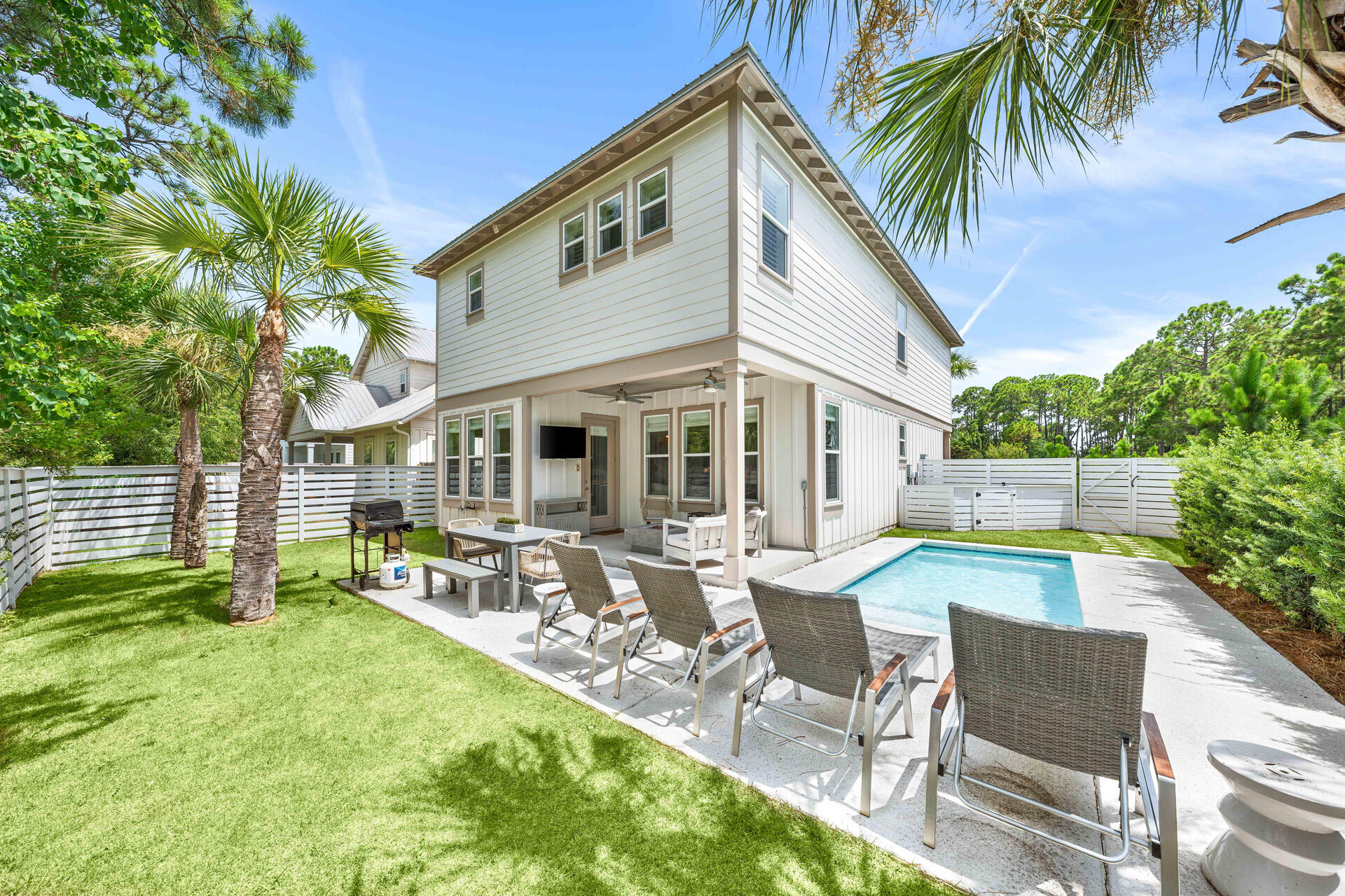 Located in the gated Villas of Frangista community within the highly desirable third addition of Frangista Beach, 61 Shelley's Way presents an exceptional opportunity to own a beautifully appointed coastal home in the heart of Miramar Beach. Featuring 4 bedrooms, 4 full bathrooms, a private pool, and access to a community pool, the property is ideally suited as a primary residence, second home, or income-producing short-term vacation rental.

The home is being sold fully furnished with only a few minor exclusions, offering buyers a convenient and nearly turnkey ownership opportunity.

Inside, the thoughtfully designed floor plan features an open-concept living, dining, and kitchen area filled with natural light and coastal-inspired finishes. Wood flooring, a soft neutral color palette, and an inviting layout create a bright and welcoming atmosphere for everyday living and entertaining. The kitchen is equipped with white quartz countertops, stainless steel appliances, a spacious island with seating, and a dedicated coffee and beverage bar complete with a wine chiller. Four well-appointed bedrooms, including a spacious primary suite, provide comfortable accommodations for family and guests, while multiple ensuite and adjacent bathrooms offer convenience and privacy. The outdoor living space is designed for enjoying Florida's year-round lifestyle. A covered porch overlooks the fenced backyard and private pool, creating an ideal setting for relaxing or entertaining. An outdoor living area with a fire feature, television, and generous patio space extends the home's living area outdoors, while the attached garage provides additional storage for beach gear and everyday convenience.

The property also offers strong short-term vacation rental and investment potential. Current rental activity exceeds $55,000 for the year, despite scheduled owner usage and blocked dates. Rental projections indicate the potential to generate up to approximately $78,000 in annual gross rental revenue when made consistently available for guest use.

Owners enjoy the privacy and security of a gated neighborhood along with access to the community pool. While the property does not include deeded private beach access, the Miramar Beach Regional Public Beach Access adjacent to Pompano Joe's is just a quick golf-cart or bike ride away. One of the area's premier public beach accesses, it offers convenient parking, restrooms, showers, bike racks, ADA accessibility, and seasonal lifeguards.

Perfectly positioned in the heart of Miramar Beach, the home places you just minutes from the white-sand beaches of the Emerald Coast, Silver Sands Premium Outlets, Grand Boulevard, Sandestin Golf and Beach Resort, championship golf, dining, entertainment, and grocery shopping. Scenic Highway 30A and its iconic beach communities are only a short drive away, while Destin's world-class fishing, boating, restaurants, and shopping are equally convenient.

Whether you are searching for a full-time residence, luxurious second home, or furnished income-producing investment property, 61 Shelley's Way delivers an outstanding combination of location, privacy, rental potential, outdoor living, and coastal lifestyle in one of Miramar Beach's most desirable gated communities.
