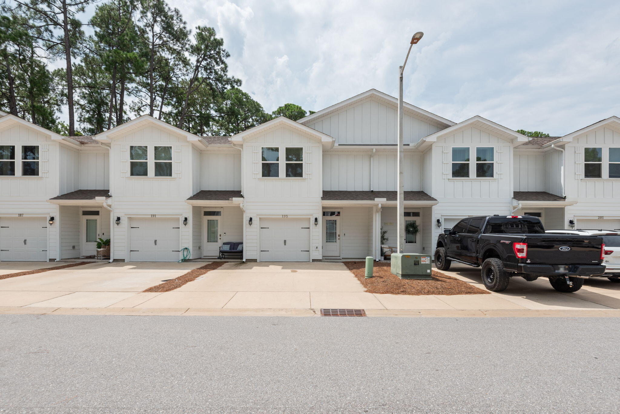 Welcome to Sandhill Pines, a modern townhome development offering coastal living just minutes from Miramar Beach and 30A! Constructed in 2021, this FULLY FURNISHED low maintenance townhome with affordable HOA fees is an extremely attractive investment.  Some artwork does not convey. Functioning well as a primary residence, second home, or rental property, this home features an unbeatable location. SHORT TERM RENTALS ARE ALLOWED. Natural light fills the living spaces, creating a warm and inviting atmosphere that works beautifully for everyday living and entertaining. The layout features an open floor plan, three spacious bedrooms and two and a half bathrooms offering flexibility for your needs.  Enjoy a plethora of luxury activities within a five mile radius. Here you will find beautiful beaches, premier shopping, and delicious dining. Grocery shopping, medical appointments, and other errands have never been more convenient with GRAND BLVD and Sacred Heart Hospital only minutes away. Move-in ready and available for immediate occupancy, this home delivers the perfect balance of comfort, convenience, and coastal lifestyle.