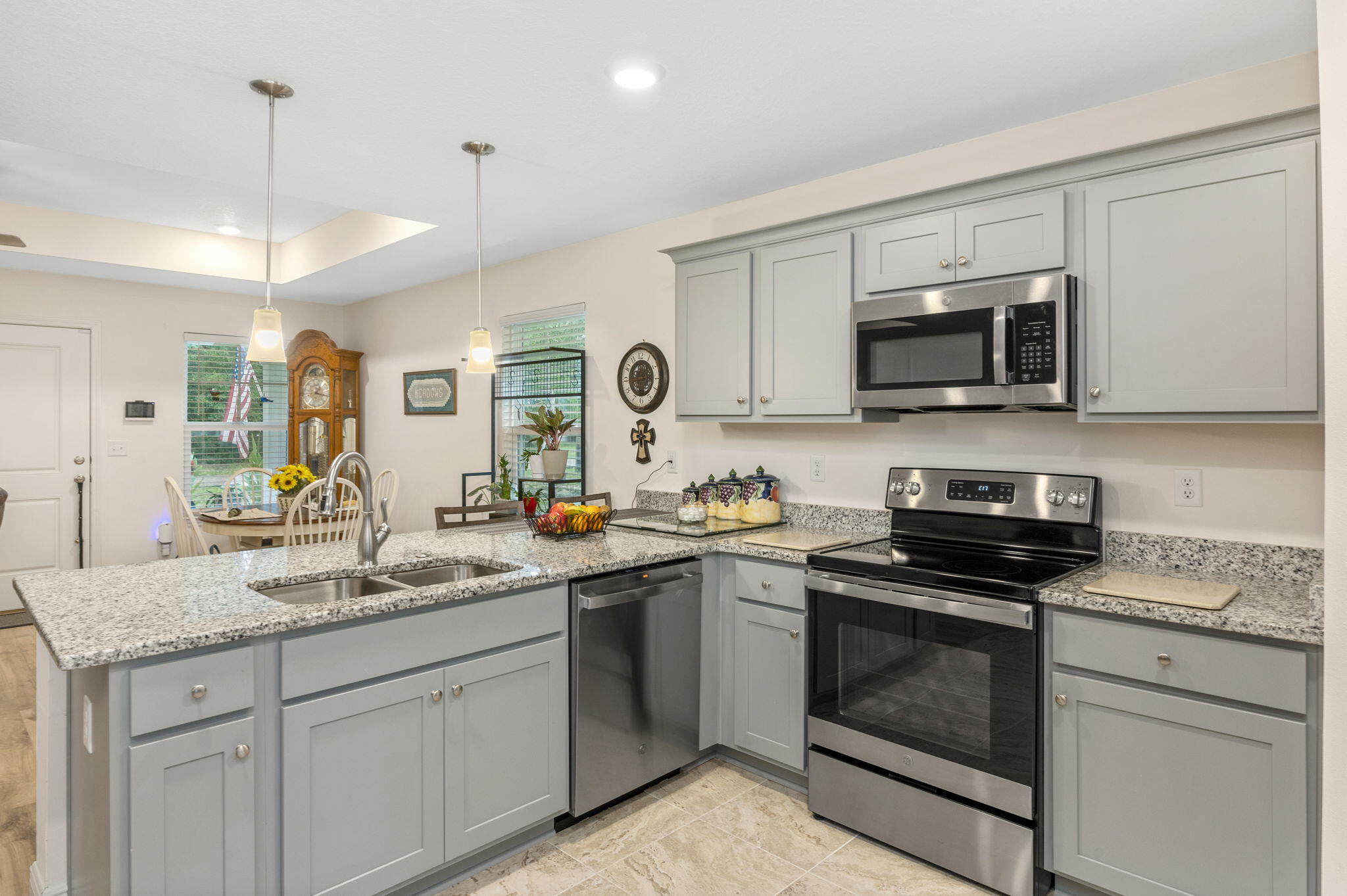 This move-in ready home is a rare find--a newer build located in a sought-after neighborhood, about a mile from the Lake Yard and vibrant Baldwin Avenue, where you'll find local shops, eateries, and entertainment.
Built in 2023, this beautifully maintained Craftsman-style home combines charm, comfort, and smart upgrades throughout. Step inside to find an open layout with new ceramic tile in all wet areas and laminate flooring throughout the rest of the home (installed April 2025). The kitchen features granite countertops with undermount sinks, shaker-style cabinets, and a full suite of stainless and black appliances.
