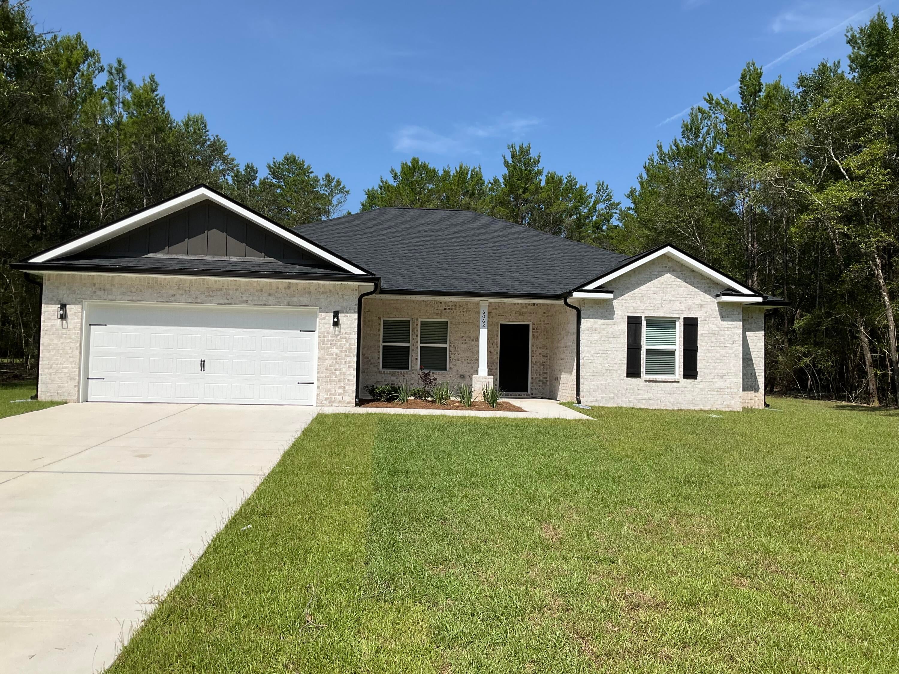 'DALTON' floor plan ready in late August.  Sitting on almost an acre, all brick construction with front & rear porches for relaxing.  Dining area off the foyer + oversized kitchen work island w/bar seating, open family gathering space has raised ceilings, recessed lighting.  Split BR design with 3 full bathrooms.  Owner's bath has his/her vanities, soaking tub + tile shower, walk-in closet & linen storage Finished 2-car-garage.  Seller/builder may contribute up to $10,000 towards buyers closing costs (call for details).  Photos of similar sold home, elevation, interior/exterior colors & finishes will vary.
