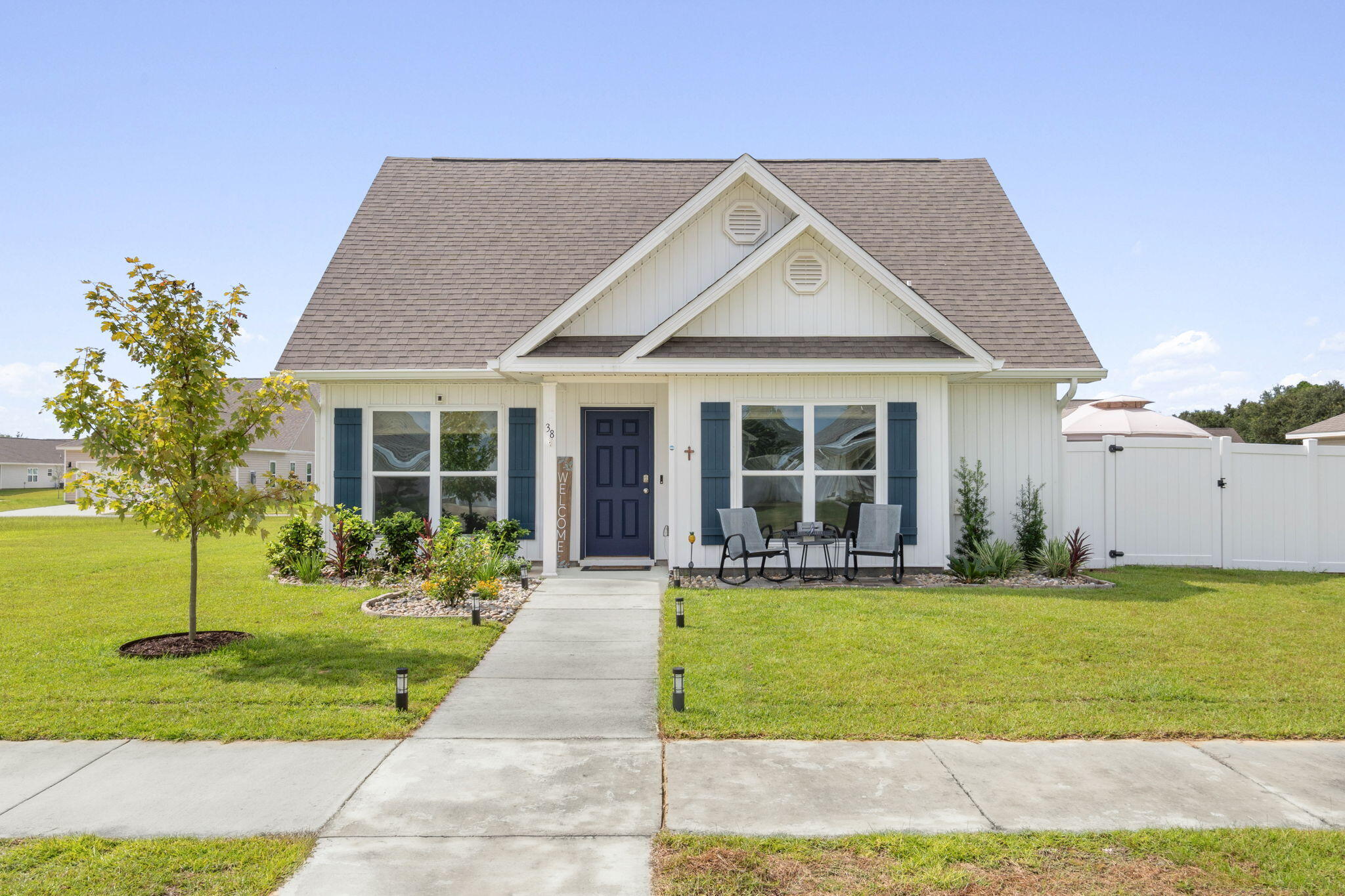 With over $20,000 worth of upgrades, this gently lived-in home offers the rare blend of contemporary design, functional comfort, and an abundance of outdoor living space! A standout feature is the fully fenced large, private side yard (easily accessed from the living area) adorned with beautiful brick pavers, lush landscaping, irrigation and a soft-top gazebo that offers shade for outdoor dining, morning coffee or family gatherings.  The LVP flooring seamlessly connects the living areas, while plush carpeting lends comfort to each of the 3 bedrooms.  The split floorplan provides privacy for the primary bedroom and an open flow between the kitchen, dining and living spaces - ideal for entertaining.