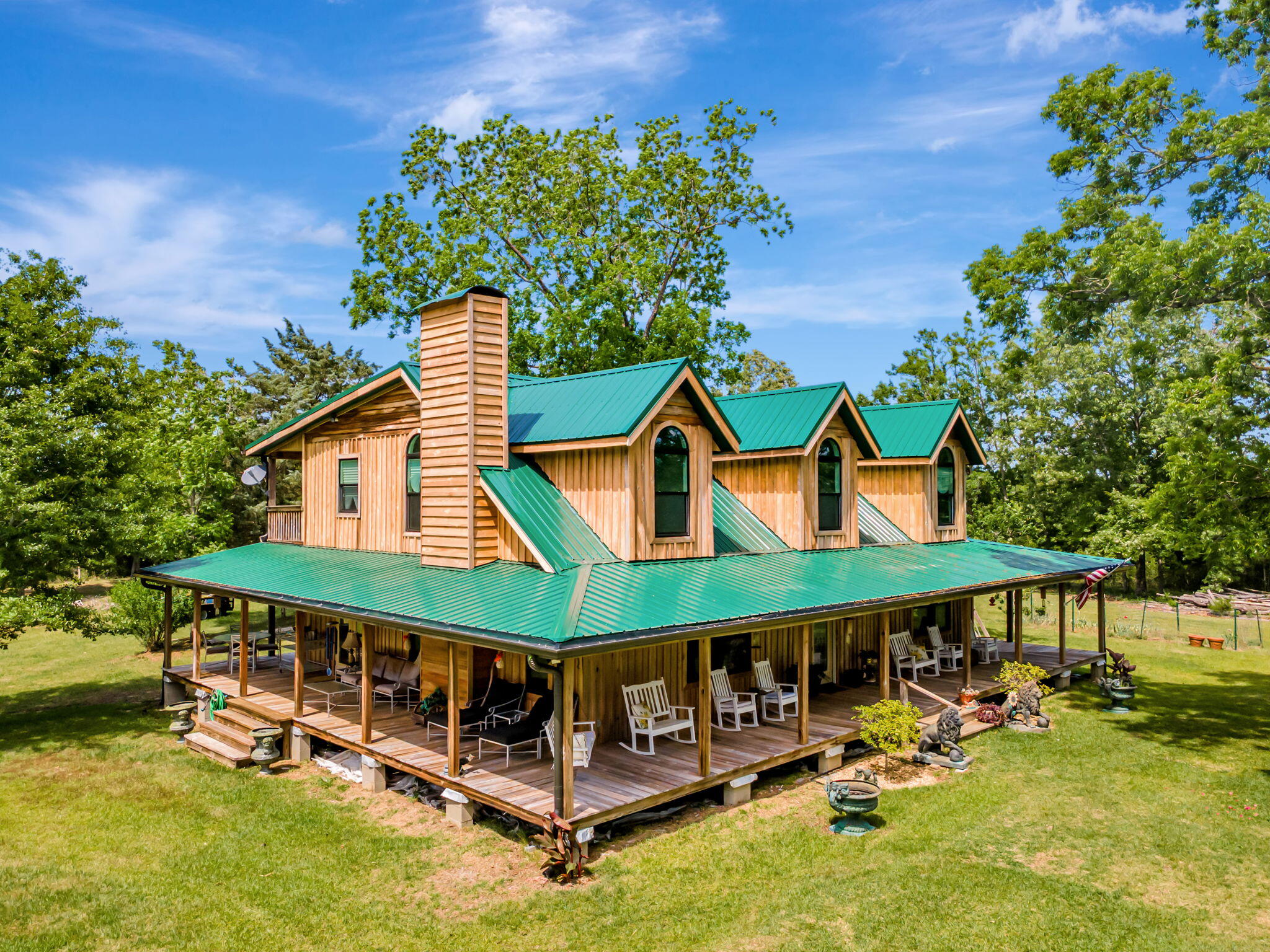 Escape to the countryside in this stunning cypress board & batten-style home, featuring 3 dormers, a spacious wrap-around porch, andendless amenities situated on 124+ wildlife-rich acres. Whether you're looking for a full-time residence, hunting lodge, micro-farm, ornature retreat. This property is a rare opportunity: New 26 Gauge Metal Roof, Fully Updated Master Bath with Ball & Claw Foot AntiqueTub, Stacked Stone & Travertine Open Shower, Dbl Sink Vanity, and Restored Poplar Wood Plank Floor, Second Master-Size GuestBedroom with Fully Updated Bathroom, & Large second Guest Bedroom (or Man-cave/Trophy Room). Newly Renovated Kitchen withCustom Cedar Cabinets, Dbl-Fold Pantry Closets, and New Granite Counters. Two Ephemeral Streams, a Pond, & Bottom Land withyear round water. Great for  families, hunters, micro-farmers, and all who look for living the "natural lifestyle. Magical memories are madehere! And just 65 Minutes form the sugar-white sand beaches of Destin and 30-A.