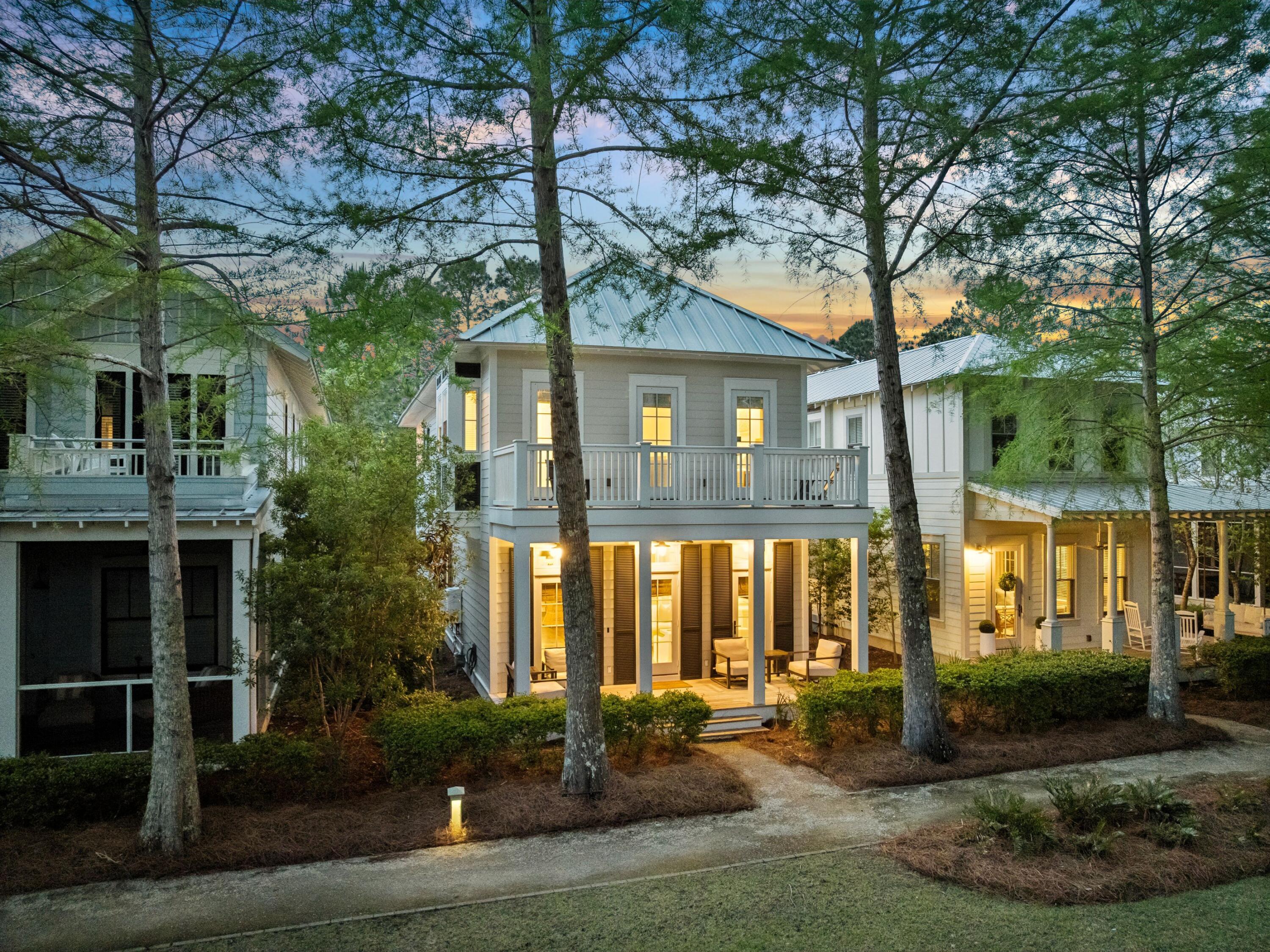 A proven and very strong rental performer, 37 Winterberry Circle has consistently done exceedingly well while being meticulously maintained and thoughtfully improved over time. Tucked within WaterColor's desirable Crossings District, this home offers a quiet, central location just minutes from the Dragonfly Pool, Camp WaterColor, Publix, Seaside, and 30A. Surrounded by green space and parks on both sides, this coastal retreat blends privacy, convenience, and timeless design, creating a setting that feels both peaceful and connected to everything WaterColor has to offer. Recently renovated, the home showcases a bright, open floor plan designed for relaxed living and effortless entertaining. Updated interiors include refreshed bathrooms, an enhanced kitchen with new countertops and appliances, upgraded lighting, high-end ceiling fans, and carefully curated furnishings that elevate the home's polished coastal feel. A whole-home Sonos sound system with built-in speakers, newly installed televisions, and a new high-speed WiFi router and modem further enhance the living experience, while a new washer and dryer add everyday convenience.

The main level features spacious living, kitchen, and dining areas filled with natural light, complemented by crisp finishes and designer details. A full bath and a private office area with sliding French doors provide flexibility for guests or remote work. Upstairs, the primary suite and two additional guest bedrooms each include private bathrooms, offering comfort and privacy for family and visitors alike.

A significant addition completed in 2022 expanded both the home's livability and outdoor enjoyment. Enhancements include a welcoming new entryway with a daybed and storage, first and second-floor screened porches designed for lounging and gathering, and an expanded side porch featuring an outdoor kitchen and grilling area. In total, the property offers more than 900 square feet of thoughtfully designed outdoor living space, a rare and meaningful extension of the home that allows life to flow seamlessly outdoors year-round.

All decking has been replaced with durable Ipe hardwood, known for its longevity and rich natural beauty, while updated landscaping, hardscaping, a redesigned patio, and a newly installed driveway further elevate the property's curb appeal. Recent mechanical upgrades provide peace of mind, including newly installed HVAC systems and a new tankless hot water system, enhancing efficiency, comfort, and long-term reliability. Additional improvements include an electric vehicle charging setup and a freshly repainted exterior that complements the home's coastal surroundings.

Outdoor living is a defining feature of the property, with multiple private spaces designed for both quiet relaxation and entertaining. A screened porch with daybed swings invites slow mornings and breezy evenings, while the home's position on a newer, quieter street provides added privacy and convenient guest parking away from busier seasonal traffic. With easy access to WaterColor's trail system, community pools, beach club amenities, and nearby Seaside, this home offers an ideal balance of comfort, style, and location. Carefully maintained and consistently enjoyed by guests, it stands as a welcoming retreat designed for making lasting memories along 30A.