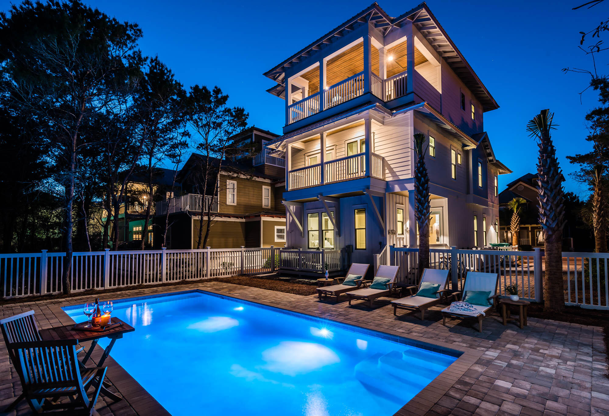 Beautiful coastal home located in Seacrest featuring 5 bedrooms and 5 full/2 half baths spread over three stories. The main kitchen and living spaces are open concept with lots of natural light. There is a bedroom on the main floor and the primary bedroom, bunk room and additional bedroom are located on the second floor. The third floor boasts a second primary brand a bonus area with 1/2 bath featuring doors that lead out to the outdoor kitchen. The outside living areas include 2 balconies off bedrooms, a top deck with built in grill, dining area and rope bed. The expansive private pool with entertaining and lounging areas is icing on the cake. You could turn in design for approval for a detached garage if new owner desires. The home is situated closely to the Seacrest subdivision lagoon pool and the beach tram service pick up is across the street.