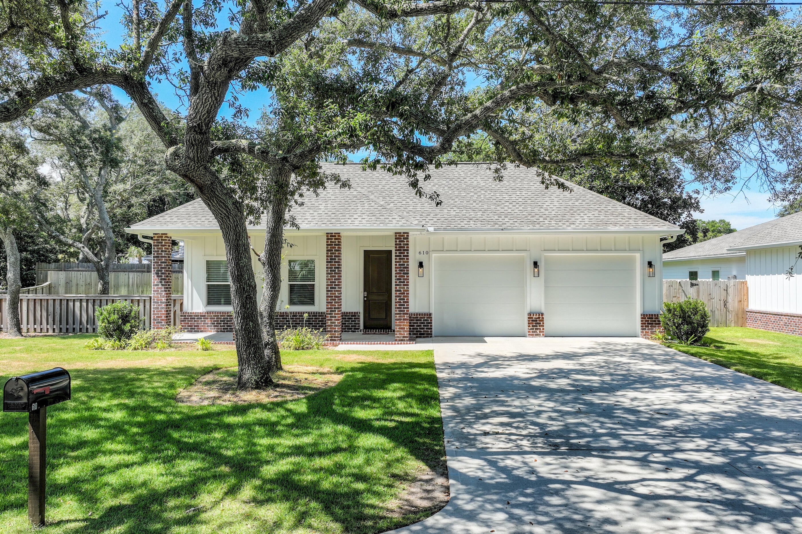 Welcome to this newly built 2024 single-family home offering the perfect blend of modern style, functional design, and unbeatable location. Featuring 4 bedrooms, 3 full baths, and over 2,100 square feet of heated living space, all thoughtfully arranged on a single level, this home is move-in ready and ideal for comfortable coastal living. Step inside to find durable vinyl plank flooring, decorative drywall finishes, and an open-concept layout perfect for everyday living and entertaining. The Hardie Board exterior and dimensional timber-style roof offer low-maintenance durability and classic curb appeal. The total area under roof is 3,062 sq ft, including covered outdoor spaces and utility areas. The home has a two-car garage and large fenced in backyard with room to park a boat....