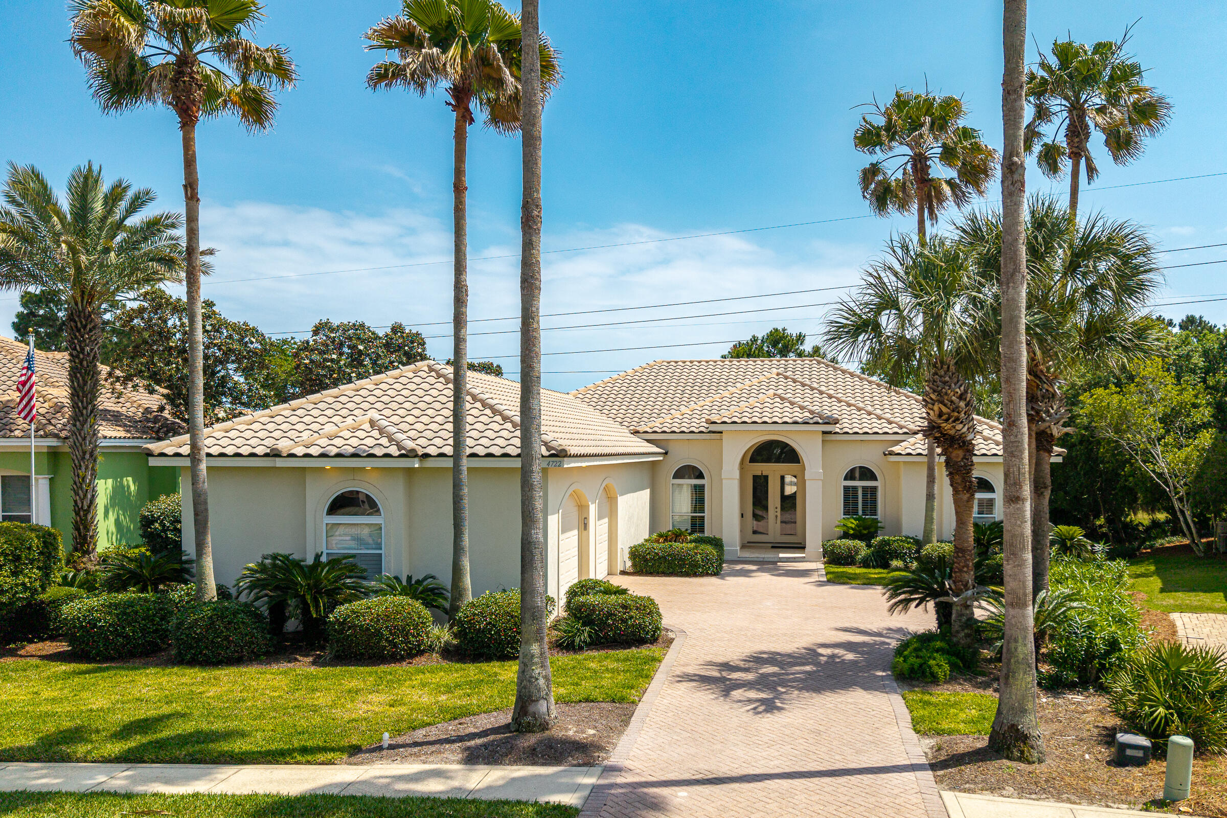 Nestled within the prestigious gated community of Destiny East, this beautifully maintained single-level home offers the perfect blend of comfort, privacy, and coastal living. Ideally located just minutes from the white sandy beaches and emerald waters of the Gulf, this property is designed for relaxed living both indoors and out. Backing up to peaceful green space, the home offers a serene setting with direct access to the neighborhood lake -- simply walk out your back door and launch your paddleboard or kayak for an afternoon on the water. The screened back porch is the perfect place to enjoy morning coffee, unwind in the evenings, or take in the tranquil surroundings. Inside, the freshly painted interior creates a bright and inviting feel throughout the home. The spacious primary suite features his and hers walk-in closets, and a luxurious bath complete with a Kohler walk-in jetted tub, bidet, and ample space to relax and recharge. The split bedroom plan allows for privacy and comfort. The office could also be used as a fifth bedroom. The open floor plan allows for easy entertaining and gathering. The additional bedrooms share a jack and jill bath room with a separate water closet. Residents of Destiny East enjoy exceptional community amenities, including a fabulous clubhouse with a complete gym, party room, theater, two lighted tennis / pickleball courts, a children's playground. Destiny East also has two large swimming pools. It is conveniently located to fabulous beaches, shopping, golf courses, restaurants and water sports. The neighborhood is a great mix of full time homeowners, investment/rentals, and second homes. This is coastal living at its best--offering privacy, recreation, and beachside convenience in an exceptional neighborhood. Don't miss this one!  Pictures with furniture are virtually staged, as home is vacant.  Buyers to verify all measurements and information.
