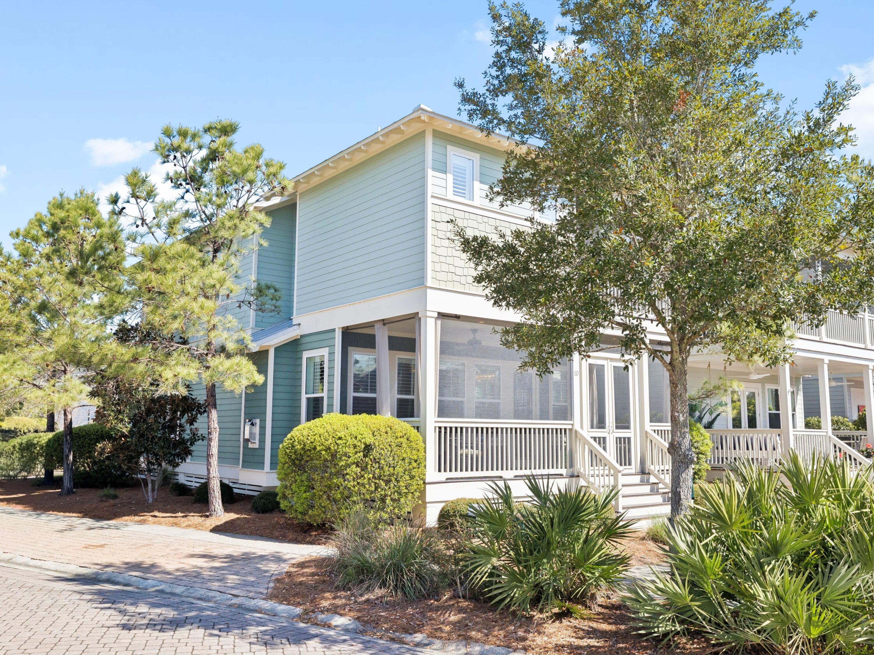 Situated on an oversized corner lot within NatureWalk at Seagrove, this exceptional property offers the perfect balance of refined living and coastal lifestyle. It is just a short bike ride from The Gathering Place amenity center and less than a mile from the beach. The bright, open living area features a cozy fireplace and flows seamlessly into a well-appointed kitchen with white shaker cabinetry, granite countertops, subway tile backsplash, and a gas cooktop. The generous dining space is ideal for entertaining large gatherings. The home offers two primary suites, including a main-floor retreat complete with a soaking tub, separate shower, and dual vanities. The upper level features three additional bedrooms, including a custom bunk room, a spacious loft, and a second primary suite with a screened porch overlooking a serene pond. As a resident of NatureWalk at Seagrove, you'll enjoy access to resort-style pools, fitness stations, scenic trails, and a dedicated path to the beach, making this an exceptional opportunity for a full-time residence or a premier vacation home along 30A.