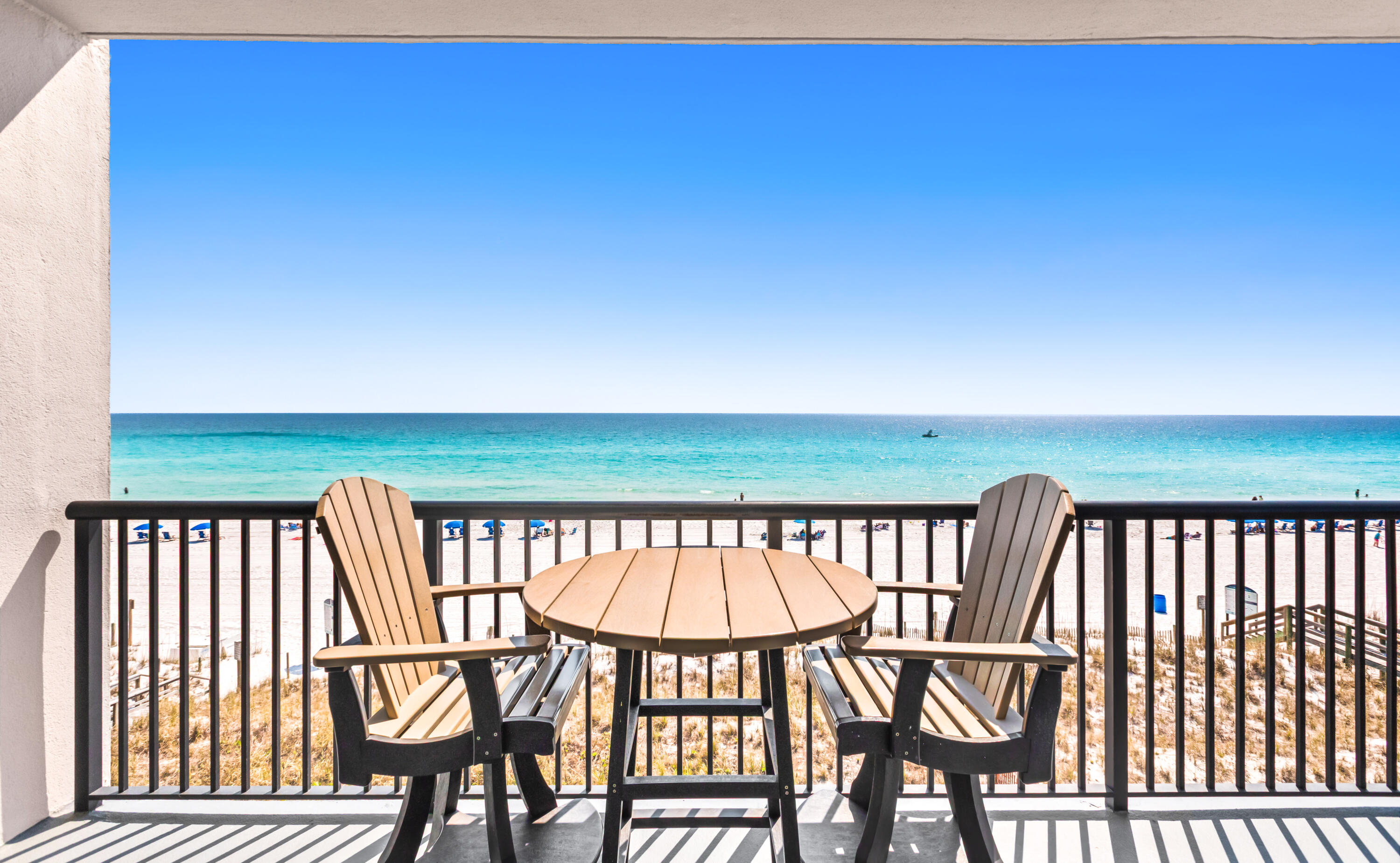 Perched on the west end of Okaloosa Island, this stunning unit offers a perspective that truly feels like you're sitting right on top of the beach. This exceptional property features two spacious king-sized bedrooms - both the primary and guest - along with a charming bunk room complete with private TVs and built-in cubbies, perfect for kids. Comfortably sleeping up to eight guests, the unit boasts a well-appointed kitchen with stainless steel appliances, Corian countertops, and ample space for entertaining. Elegant details such as 9-foot ceilings and crown molding enhance the open feel, while practical features include two interior storage closets plus an additional storage unit in the parking garage. Assigned covered parking spot in the parking area also conveys with unit.  Meticulously maintained, the property is part of a well-managed association with a strong reserve budget - an uncommon benefit for a smaller community. Recent updates include a new HVAC system (2021) and water heater (2024). Ideally located on the Island, this private retreat offers both convenience and coastal charm.  Unit on rental program grossed $57,000 last year. Come check out this rare property - it's a great place to own and enjoy your piece of the Gulf Coast!