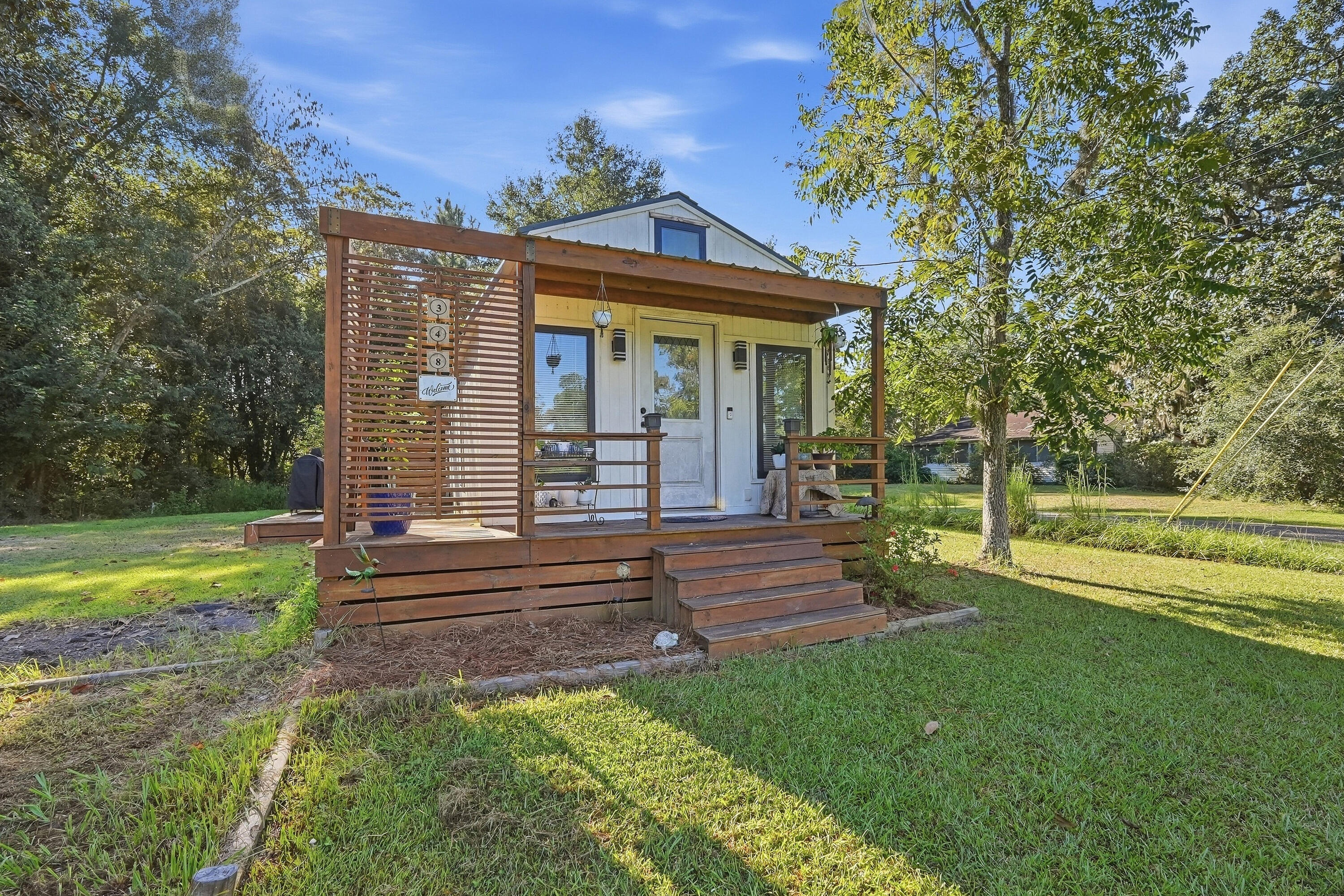 This AMAZING bungalow / tiny home is located 1 block from Lake Jackson and the public boat ramps. Built in 2021 and completely updated in 2023 all you need is to pack a weekend bag or pack up and live here in peace! Home sits on 2 lots with the lot next door vacant and is perfect for being able to build storage for all your lake toys! You are welcomed by a great front porch, you enter into the living room which is open and includes a electric wall fireplace and tons of room to make it home! The layout left no area without unbelievable storage space through the entire home. Remodeled with all top of the line materials to include luxury flooring and all Anderson windows. The kitchen offers a bar area with power and the remainder of the kitchen is super functional and well thought out. The master bedroom offers a great closet as well as laundry room and storage. This home may be tiny but the bath is great and comfortable. Large side patio perfect for afternoon relaxing and entertaining.