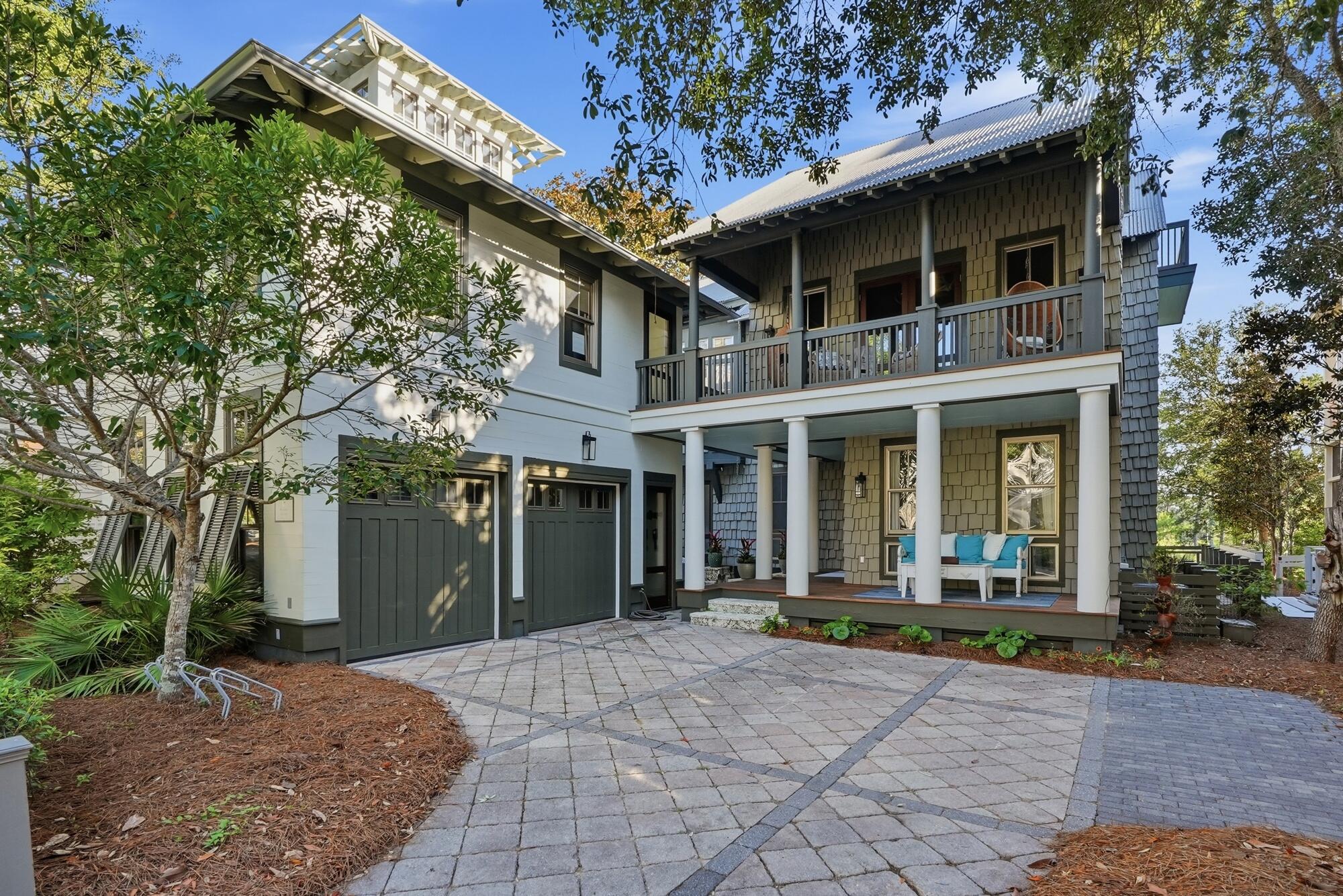 21 Blackwater Street presents a rare opportunity to own one of 30A's most compelling waterfront residences--offered at an extraordinary value, approximately $800,000 below appraised value. Spanning 4,563 square feet across three thoughtfully designed levels, this six-bedroom, five-and-a-half-bathroom home blends refined architecture, sophisticated interiors, and an unparalleled connection to the natural beauty that defines the Emerald Coast.

From the moment you enter, a rich blend of maple and walnut cherry hardwood flooring, a striking glass-railed staircase, and expansive lake views establish a sense of understated elegance. The main living area is anchored by custom built-ins and framed by windows that capture the ever-changing scenery of Western Lake. Designed for both entertaining and everyday living, the chef's kitchen features an oversized island, a Viking range, built-in coffee system, premium Liebherr refrigerator, and generous gathering spaces that flow seamlessly to multiple porches overlooking the water.

The second-floor primary suite offers a private retreat with its own balcony, dual walk-in closets complete with custom cabinetry, a dedicated makeup vanity, and a spa-inspired bath featuring a soaking tub and separate shower room. Additional accommodations include spacious guest suites, a custom bunk room, a media room with built-ins, and a fitness room with wet bar, creating exceptional flexibility for hosting family and friends. Outdoor living is equally impressive. An intimate courtyard centered around a fireplace and fountain invites relaxed evenings beneath the stars, while oversized screened porches provide front-row views of one of South Walton's most treasured coastal dune lakes.

A two-car garage, abundant storage, and carefully curated design details throughout enhance both comfort and functionality. Just moments from WaterColor's celebrated amenities--including resort-style pools, nature trails, parks, and access to the Gulf--and within easy walking, biking, or golf cart distance of Seaside, acclaimed dining, boutique shopping, and the sugar-white beaches of 30A, this residence embodies the effortless luxury and coastal lifestyle for which the community is renowned. Short-term rentals are permitted, further enhancing the property's versatility and investment potential.