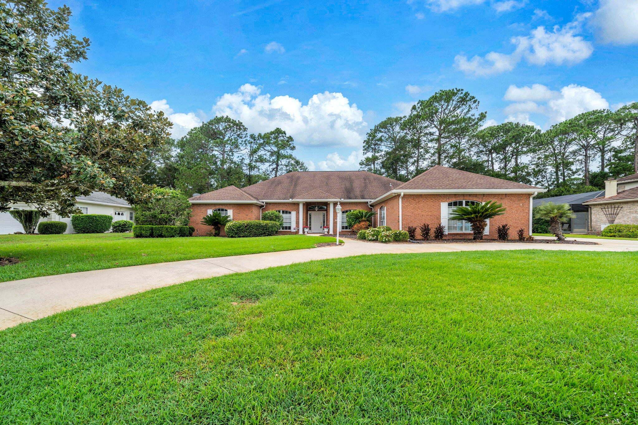 Welcome to this charming home with an enclosed salt water pool located on a .48 acre lot backing up to the preserve in the private community of Glenlake of Bluewater Bay. Nestled between the beautiful lake in Glenlake in the front and the preserve in the back, your privacy is ensured. This home with just under 3000sf offers 3 en-suite bedrooms PLUS an office PLUS a large room off of the master suite that can be utilized in a variety of different ways. A circular driveway graces the front of the home and leads you to the wide entryway. Through the front door, you will find a formal dining room on your right open to a large living room with a wall of sliding glass door opening to the screened-in lanai and sparkling pool.  The living room features built in display shelves and storage areas and it is open to the formal dining room with plenty of room for oversized furniture.  The chef's kitchen, also open to the living room, features an abundance of cabinets, beautiful granite counters, a moveable island, a breakfast bar and a large informal dining area overlooking the tree filled back yard. The office is located off of the living room overlooking the front yard and lake. The master suite features a luxurious bath with a dual sink vanity, two walk in closets, a soaking tub and a large walk-in shower! There are also sliding glass doors from the master bedroom that lead to the multi-purpose room in the back of the house. On the other side of the house, you will find 2 additional en-suite bedrooms with one of the full bathrooms also serving as a "pool bath" offering direct access to the back yard and pool area. The large lanai offers both a covered patio space as well as open space around the pool making this an extension of the living areas of this home. In addition to all of these features, you will also enjoy the oversized 2-car side loading garage with a golf cart garage as well. Additional information: 2020 water heater, 2016 HVAC system 2014 roof and a sonos system with monitors and outside IR cameras are also offered in this sale. NOW is your time to make this wonderful home your own!!