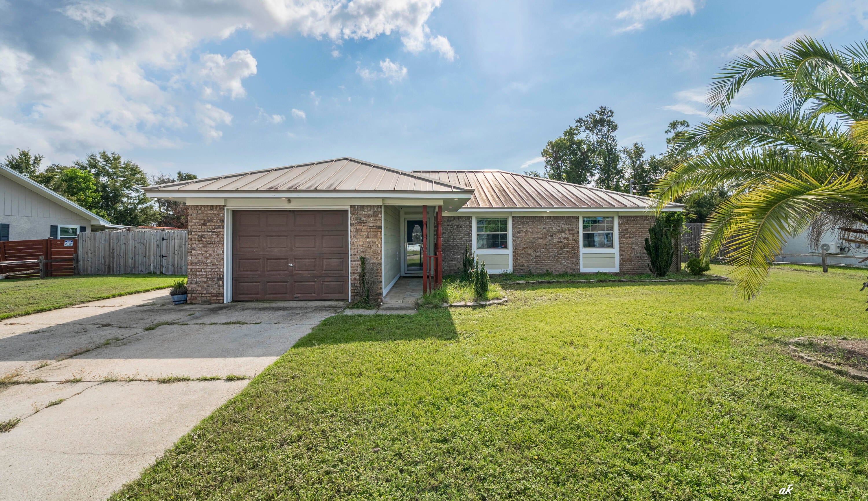 Beautifully Remodeled 3-Bedroom Home on a Spacious Fenced Lot in Lynn Haven. This is a beautifully remodeled 3-bedroom, 2-bath home situated on a generous 0.34-acre lot with a fully fenced, flat backyard. Thoughtfully updated throughout, this home combines quality finishes, practical features, and inviting spaces designed for comfortable everyday living. The remodeled kitchen features high-quality, ceiling-height upper cabinets, elegant stone countertops, stainless steel appliances--including a range, dishwasher, microwave, and refrigerator--and a deep apron-front sink. The dining room offers additional character and functionality with a built-in buffet and extra cabinetry, along with a charming seated bay window that brings in plenty of natural light. Stone flooring extends throughout the home, complemented by fresh new paint for a clean, move-in-ready feel. The bathrooms have also been beautifully updated, including a walk-in tiled shower in one bathroom and a gorgeous tub/shower combination in another. For additional living space, enjoy the enclosed sunroom, complete with a shower--an incredibly versatile area that could serve as a relaxing retreat, hobby space, or additional flex space. Outside, the property truly shines. The large, fully fenced 0.34-acre backyard is flat and spacious, offering plenty of room for outdoor entertaining, gardening, pets, recreation, or future possibilities. A large enclosed storage shed provides valuable additional storage, while the single-car garage adds convenience. With extensive remodeling, quality finishes, abundant storage, and a spacious fenced lot, this Lynn Haven home offers a rare combination of comfort, functionality, and character. Come see all that 1607 New Hampshire Ave has to offer!