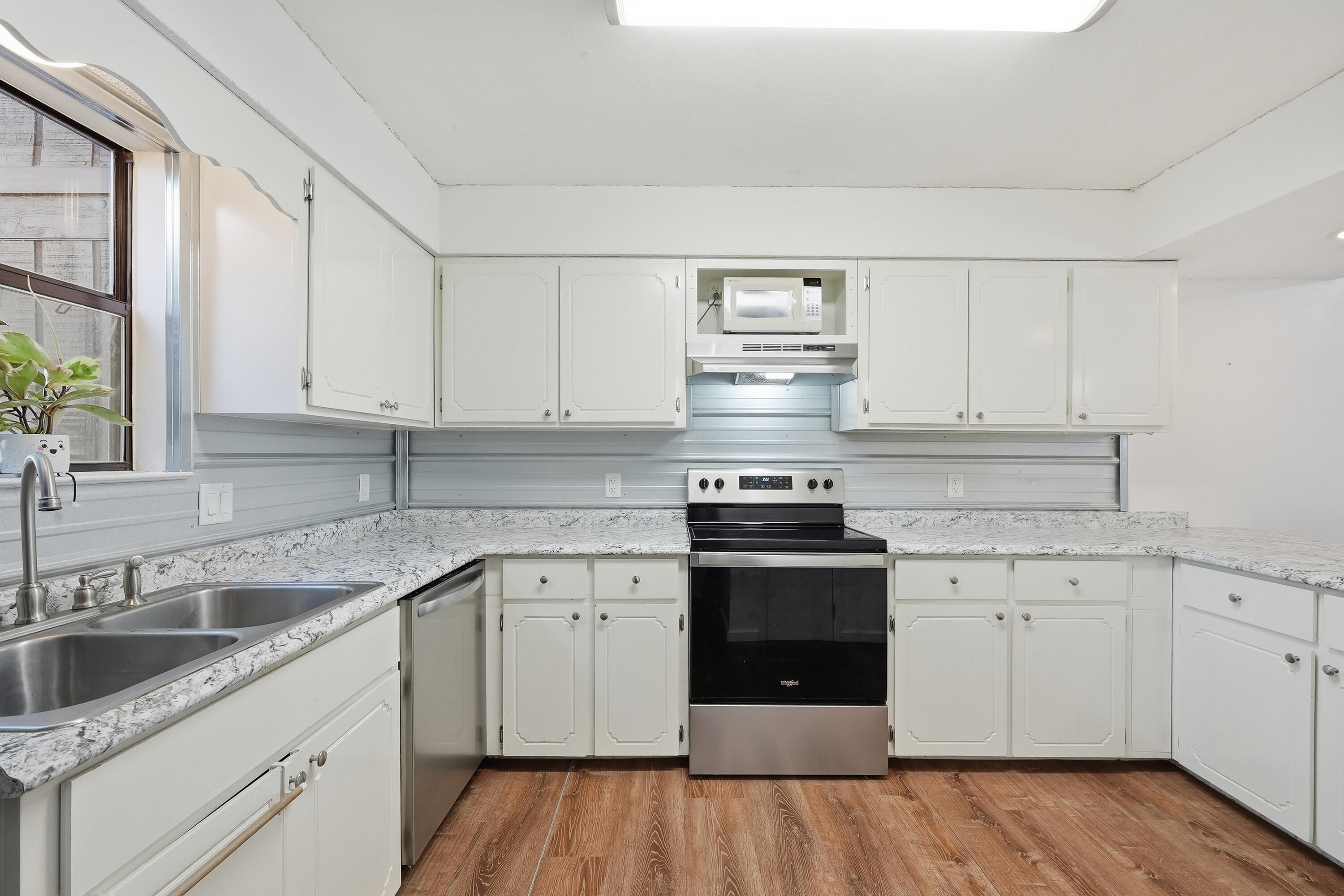 Tucked away on a quiet street just minutes from Eglin Air Force Base, this charming townhome with a garage offers both privacy and convenience. Spacious and thoughtfully updated, the home features an open living and dining area that flows seamlessly into a large kitchen. The kitchen shines with freshly painted white cabinetry, new countertops, a stylish metal backsplash, a pantry with wood shelving, and stainless-steel appliances. Enjoy peaceful outdoor living with a backyard that offers a woodsy feel, a patio for relaxing or entertaining, a partially replaced privacy fence, and a balcony off an upstairs bedroom. The attached garage is connected to the home by a covered walkway for added convenience. Move-in ready with major updates already completed: Brand-New Roof (2022). No HOA. A rare opportunity to own a well-updated, centrally located home in desirable Shalimar! Throughout the home, you'll find a freshly painted interior, updated doors, faucets, and sinks, and generous storage with wood shelving in all closets. Upstairs offers three comfortable bedrooms and two full bathrooms with updated countertops, while downstairs includes a convenient half bath and laundry room with added cabinetry. Attractive laminate wood flooring adds warmth and durability to the living spaces, creating a move-in-ready home perfect for military families, first-time buyers, or investors alike.