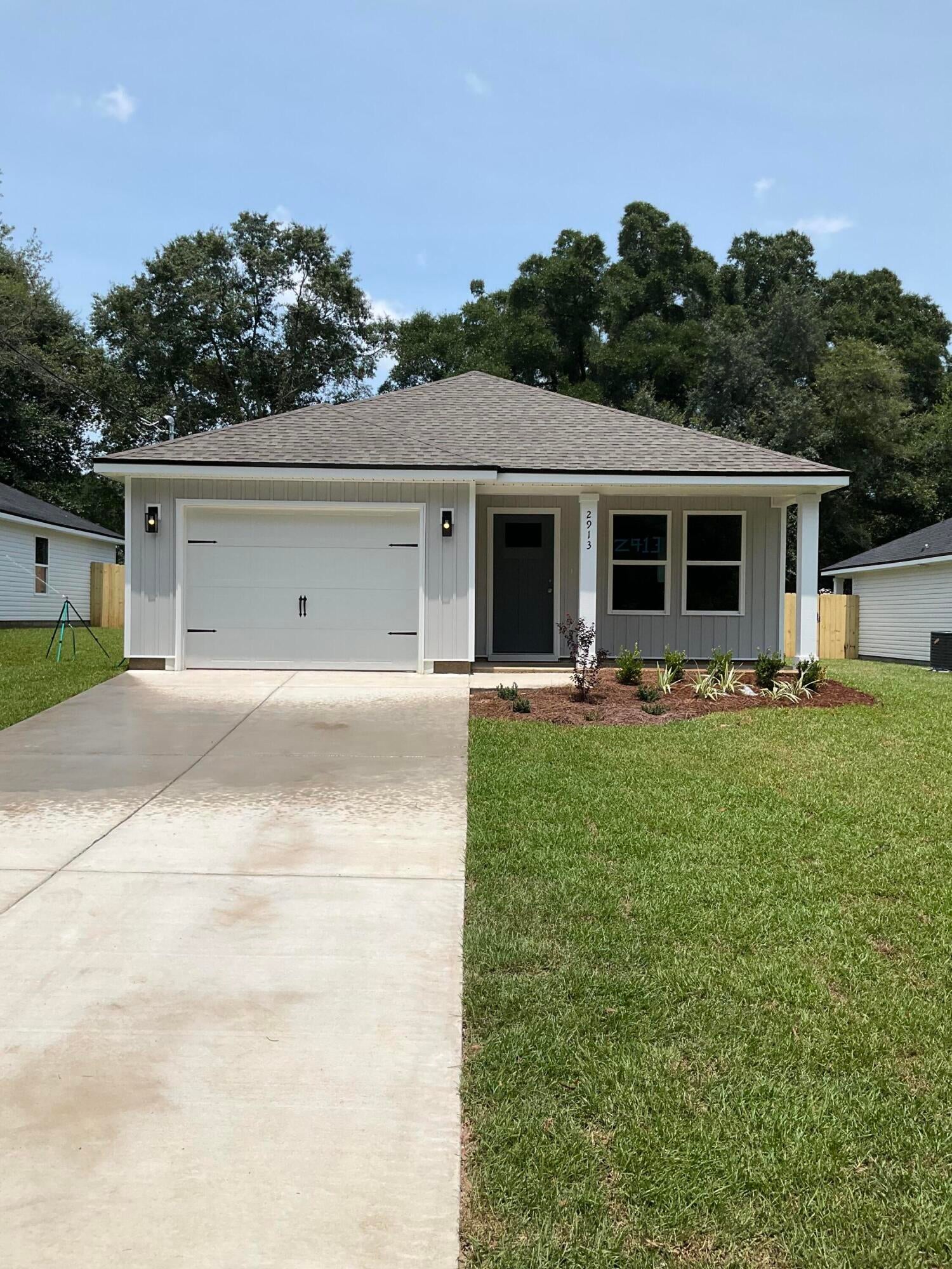 CONVENIENT MID-TOWN LOCATION - BUDGET FRIENDLY - All packed into the 'Scarlet' floor plan.  Seller will contribute up to $12,000 towards buyers closing costs (call for details).  Vinyl plank flooring throughout, landscaped yard with privacy fencing, front & rear porches for relaxing, finished garage.  Raised ceilings, recessed lighting, quartz work island w/bar seating, corner walk-in pantry, walk-in closet in owner's bath w/double vanities, large laundry room, ceiling fans thru-out, white shaker style cabinets.  Photos of similar sold home, elevation will vary, interior/exterior colors & finishes will vary.