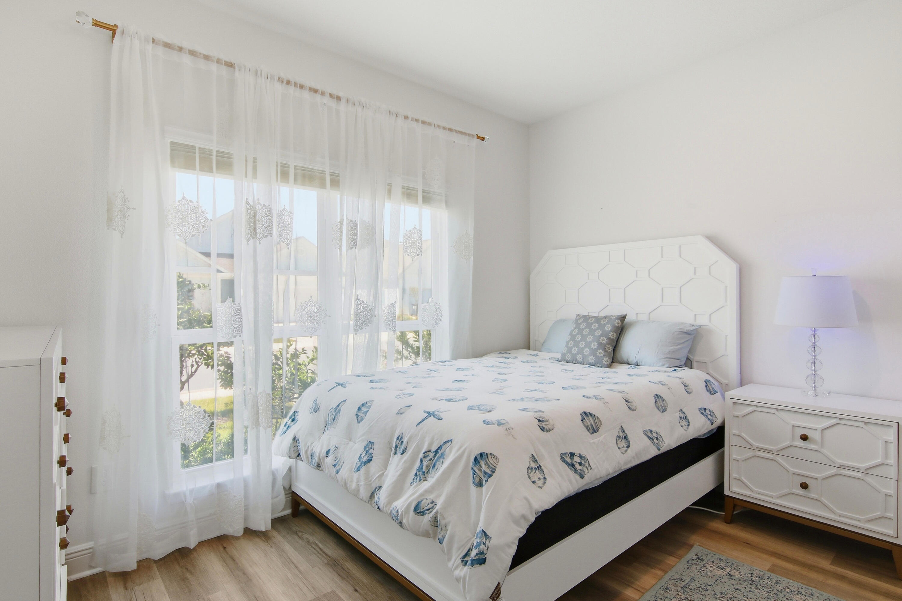 Imagine living just minutes from the sugar-white sands and emerald waters of Scenic 30A, with a backyard filled with fruit-producing citrus trees. Located less than four miles from public beach access, this beautifully maintained 4-bedroom, 3-bath home with a dedicated office features the sought-after Kennedy floor plan, offering the convenience of single-story living. Nestled in Walton's Landing, a short-term rental-friendly community, residents enjoy a community pool, scenic walking paths, tranquil ponds, and a central location. Inside, the open-concept design features vinyl plank flooring throughout, a spacious living area filled with natural light, and a beautifully appointed kitchen with quartz countertops, ivory shaker cabinetry, and ample prep space. 
The generous primary suite offers a large walk-in closet and a spa-inspired bath with a tiled shower and soaking tub. Additional upgrades include a security system with a doorbell camera, three exterior cameras, and upgraded ceiling fan fixtures in the bedrooms. Outside, the backyard is a true Florida retreat with more than 25 mature citrus trees - including kumquat, lemon, red navel orange, grapefruit, and mandarins-all currently producing fruit. Beautiful rose bushes enhance the front yard, while the screened-in covered porch with epoxy flooring provides the perfect place to relax and enjoy. The garage also features epoxy flooring, a whole-house water filtration system, along with a separate filtration system for the irrigation, allows you to enjoy fresh citrus right from your own trees. This home offers the perfect combination of coastal convenience and outdoor enjoyment.