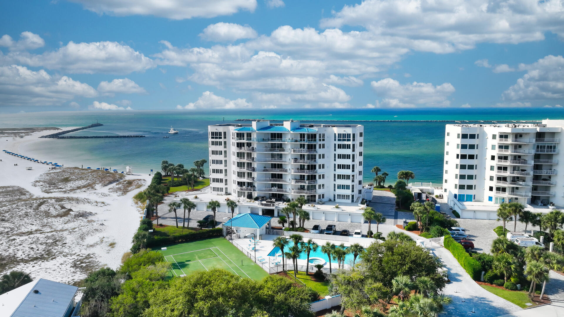 What's Special? Breathtaking Views of the Destin Pass, Destin Harbor and the Gulf. Two Adjacent Private Garages with a Climate-Controlled Storage Unit. A Boat Slip Designed for a Large Vessel. Two Expansive Balconies, One Featuring a Built-in Natural Gas Grill.

 Experience The Ultimate condominium lifestyle in this stunning, fully furnished west-end unit, showcasing three spacious bedrooms, three full baths and a versatile bonus room that can serve as a private office or bunk room. With 2,630 square feet of waterfront living, you'll be captivated by the tropical views from every room ensuring you'll never miss a sunset.  This expansive condo offers ample space for entertaining, including two living rooms with floor-to-ceiling windows.