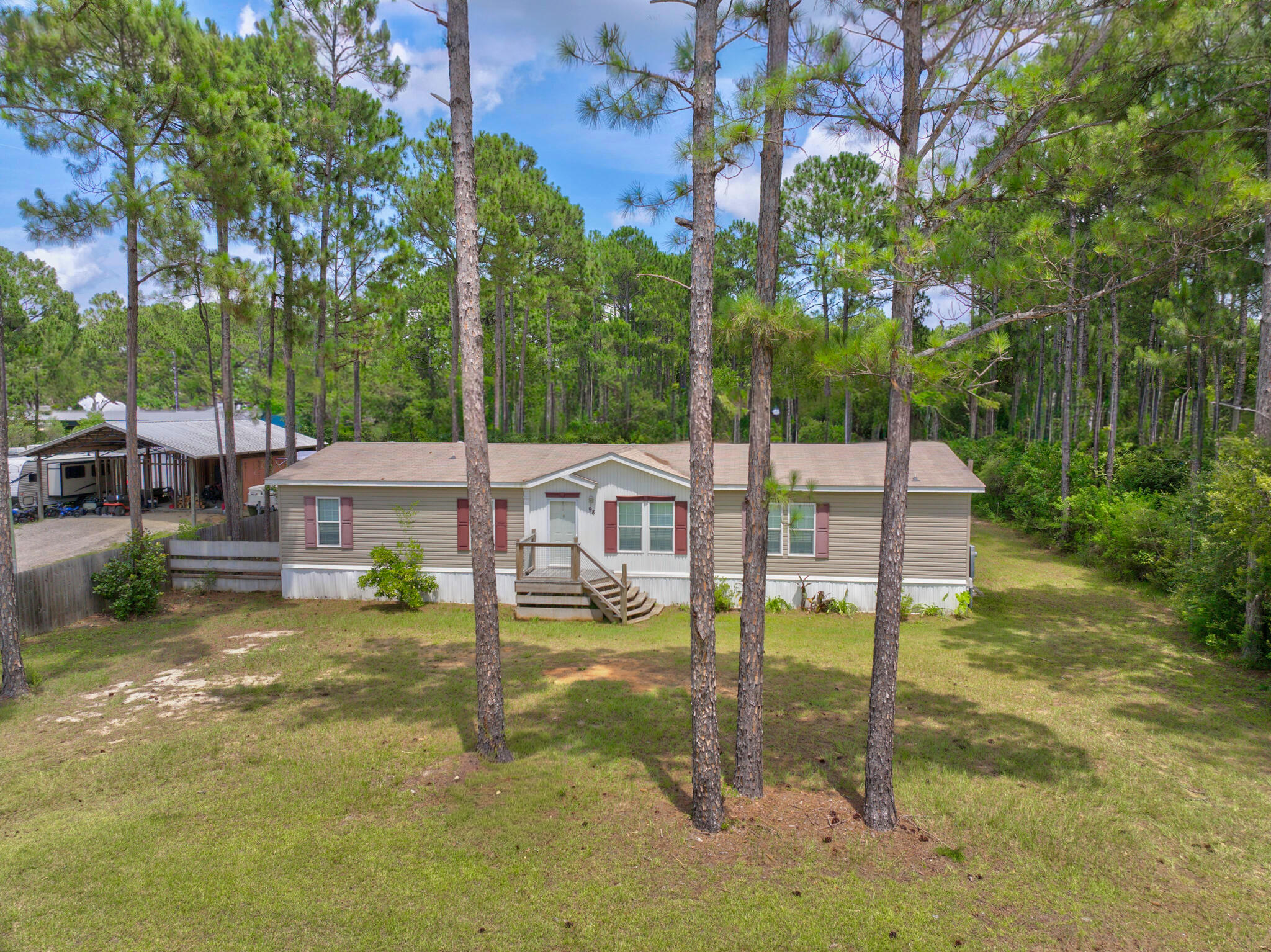 Spacious 5-bedroom, 3-bath mobile home built in 2017, offering over 2,100 square feet of comfortable living space in North Santa Rosa Beach. This well-maintained home features an open floor plan, generous bedrooms, and plenty of room for family and guests. Located only minutes from the beautiful beaches, dining, and attractions of 30A.