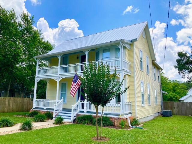 HISTORIC HOUSE OF YOUR DREAMS! Big Price Reduction for this exquisite 4 BR, 3.5 BA home in the heart of the DeFuniak Springs Historic District. Just one block from Lake DeFuniak. Enjoy small town living with a vibrant downtown business district and lots of social activities. This property has been fully updated, including newer plumbing, electrical & windows, plus a new metal roof in 2023. Granite countertops & stainless appliances in 2021. One BR, one full BA, & one half-BA downstairs, plus 3 bedrooms & 2 more baths on the 2nd floor. Crown molding throughout. Two spacious front porches, a rear screened porch, fenced yard, carport, storage shed and plenty of rear parking complete this most desirable home. Small town lifestyle, plus our white sand Gulf beaches are just 30 minutes away!