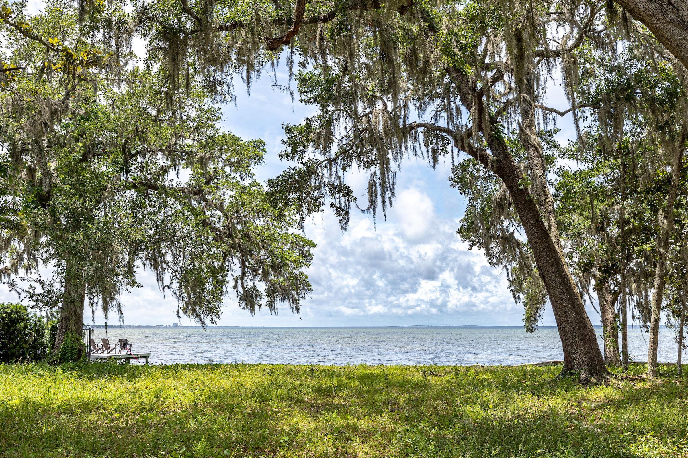 Prime Bayfront Opportunity: 3040 & 3041 The Oaks in Burnt Pine Sandestin Resort.
Discover the most desirable, unique and very last vacant Bayfront home site opportunity in Burnt Pine at Sandestin Resort! These lots (Lots 3 and 4) create a spacious Bayfront offering with breathtaking sunset views over the sparkling Choctawhatchee Bay.
Framed by majestic oaks and magnolia trees, this home-site, the very last of it's kind in gated Burnt Pine, provides a serene, private setting perfect for building your dream coastal estate. Enjoy easy access to world-class amenities including Sandestin's four championship golf courses, 93-slip marina, tennis facilities, pools, beach club and more. The location is also conveniently close to shopping, dining, and entertainment at Grand Boulevard and The Village of Baytowne Wharf and 30A.

Lot Size: .82 acre (combined)
Zoning/Type: Residential vacant land
Key Features: Bayfront, mature trees, sunset views, gated community access

Whether you envision a custom luxury home or a family retreat, this rare property in the heart of Sandestin Resort's premier resort lifestyle offers unparalleled potential. Don't miss your chance to own a piece of coastal paradise!