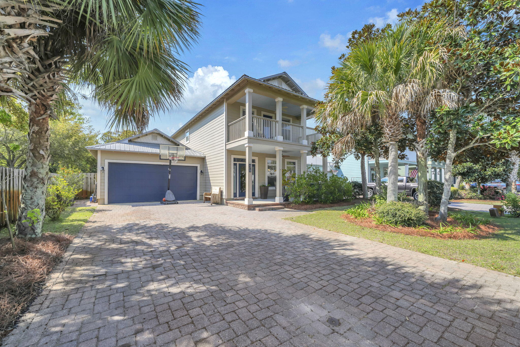 This stunning 4BR/3.5BA home in Eagle Bay offers style and functionality with two master suites, a two-car garage, screened-in porch, and fenced backyard. Privately situated on a beautiful lot overlooking a charming pond, it provides a peaceful, serene setting. The main level features updated flooring, a remodeled kitchen, separate dining area, and primary master suite. The kitchen showcases a brick veneer backsplash, refaced lower cabinets, new upper cabinetry, granite countertops, and stainless-steel appliances. The main-level master includes a wainscoting accent wall and an updated en-suite with quartz double vanity and a remodeled walk-in shower. Ideally located steps from the bay and just minutes from the beach.