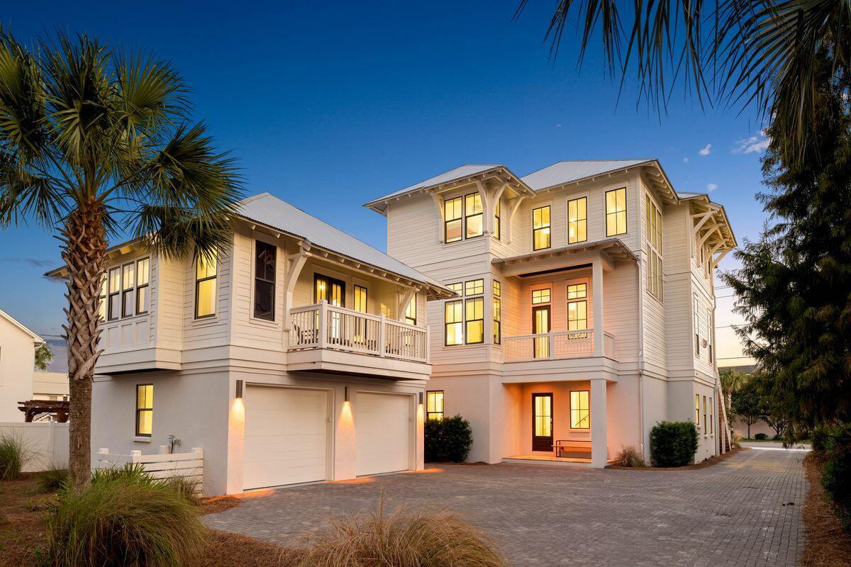 Tucked within the quiet coastal enclave of Gulf Shore Manor, this Seagrove Beach estate captures the rare balance of privacy, scale, and proximity that defines legacy ownership along 30A. Just moments from the sugar white sands of the gulf and minutes from the iconic town center of Seaside, Florida, the setting feels both removed and remarkably connected -- a peaceful retreat with the energy of the coast close at hand. Built in 2019 and spanning more than 5,300 square feet, the residence was thoughtfully designed for multigenerational living and effortless entertaining, with gathering spaces balanced by quiet areas for retreat. The first floor establishes an inviting sense of arrival, anchored by three ensuite guest bedrooms, including a substantial bunk suite, and an intimate sitting room that offers a relaxed place for conversation or morning coffee. An elevator provides seamless access to all levels of the home. The second floor unfolds into the heart of the residence, where soaring ceilings, abundant natural light, and refined coastal finishes create an atmosphere that feels both elevated and welcoming. The great room flows naturally into the dining and kitchen spaces, designed to accommodate large gatherings with ease. A Sub-Zero and Wolf appliance package, waterfall-edge countertops, oversized island, wet bar with beverage refrigeration, dual Asko dishwashers, and generous storage reflect a level of craftsmanship and functionality rarely found in coastal homes of this scale. Also located on this level is a well-appointed ensuite king bedroom, offering comfort and privacy for guests. Just beyond the main living spaces, the home extends outward to an expansive second-floor entertaining terrace complete with a private pool, water feature, outdoor dining area, and grilling station. Framed by multiple covered porches and balconies spanning all three levels, the outdoor spaces were designed to embrace the rhythm of coastal living while offering glimpses of the gulf from several vantage points throughout the home. The third floor is dedicated to the home's most private spaces, crowned by a serene primary suite with vaulted ceilings, gulf views, porch access, and a spacious spa-inspired bath with an oversized walk-in shower and expansive closet. An additional guest suite and bunk room complete the level, along with a flexible recreation lounge featuring a wet bar, wine refrigeration, and ice maker -- ideal as a media room, game lounge, or relaxed secondary living space. Adding flexibility and long-term appeal, the carriage house above the detached two-car garage functions as a private guest retreat with its own living area, kitchenette, bedroom, and bath. Whether used for visiting family, extended stays, or supplemental rental income, the additional living quarters enhance both functionality and versatility.The investment profile is equally compelling, with a projected rental income of $386,000, underscoring the property's exceptional appeal to the discerning vacation rental market along 30A. Beach access is exceptional on multiple fronts. The property benefits from a private gated beach walkover shared among a select group of Gulf Shore Manor owners, along with deeded beach usage rights and two additional nearby public access points at Pelayo Street and Santa Clara Street. Surrounded by native landscaping in one of Seagrove Beach's most coveted neighborhoods, this is a home designed not simply for vacations, but for gathering generations, creating traditions, and experiencing life along the coast at an elevated level."
