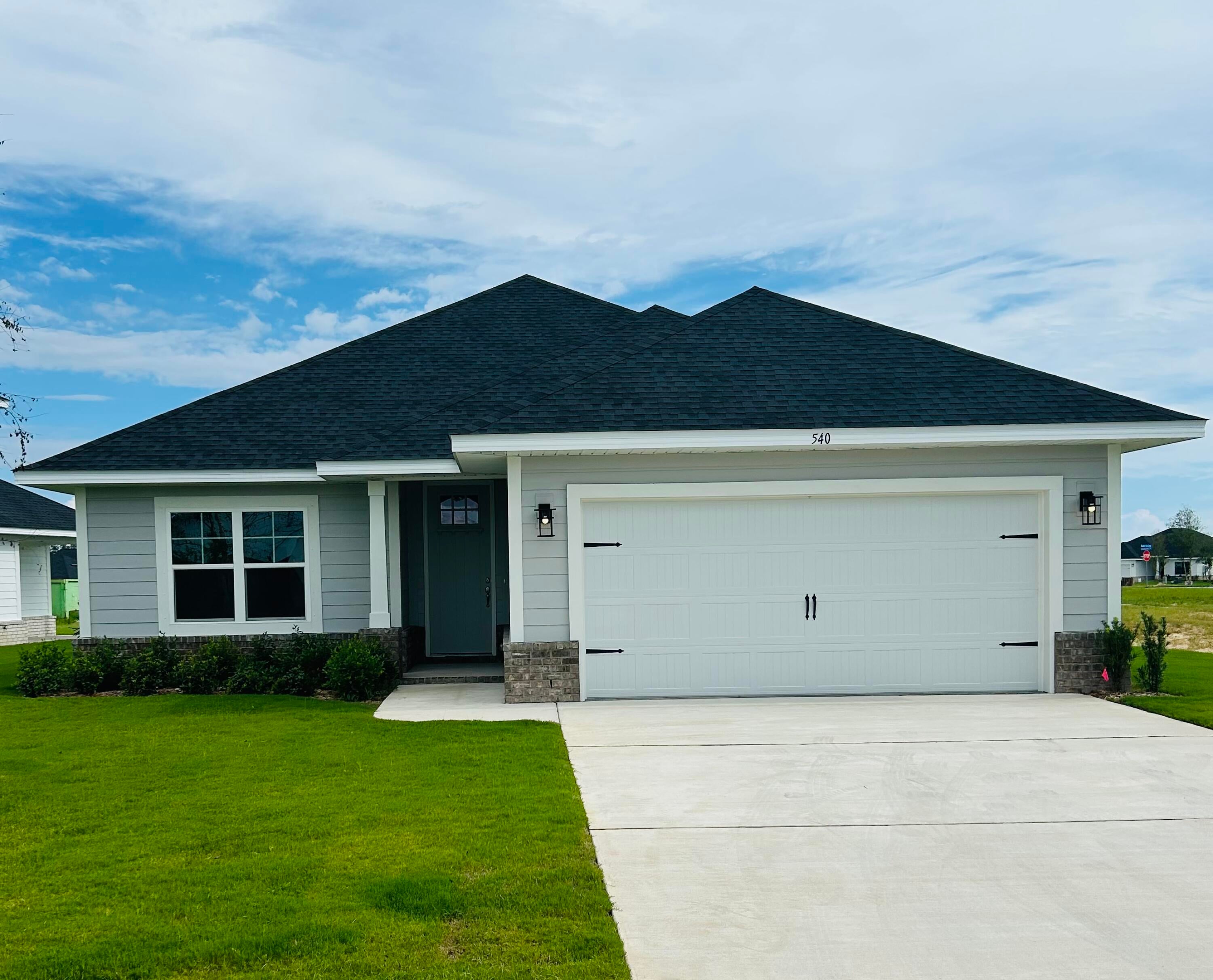 Limited-Time Incentives Available!
Receive up to $25,000 off this beautiful home. Ask about our 3.99% interest rate buy-down with preferred lender. USDA financing available with zero down for qualified buyers.
This popular Craftsman-style 3BR/2BA home features HardieBoard® siding with brick skirt, 9' ceilings, 8' entry doors, and Coretec Pro Plus LVP flooring throughout—no carpet. The spacious primary suite (14' x 22') offers a tray ceiling, large walk-in closet, and spa-like bath with separate tub and shower. Enjoy quartz countertops in the kitchen and baths, soft-close cabinetry, a covered patio, fully sodded yard with irrigation, private well & pump, and garage opener. Community amenities include a pool and cabana.