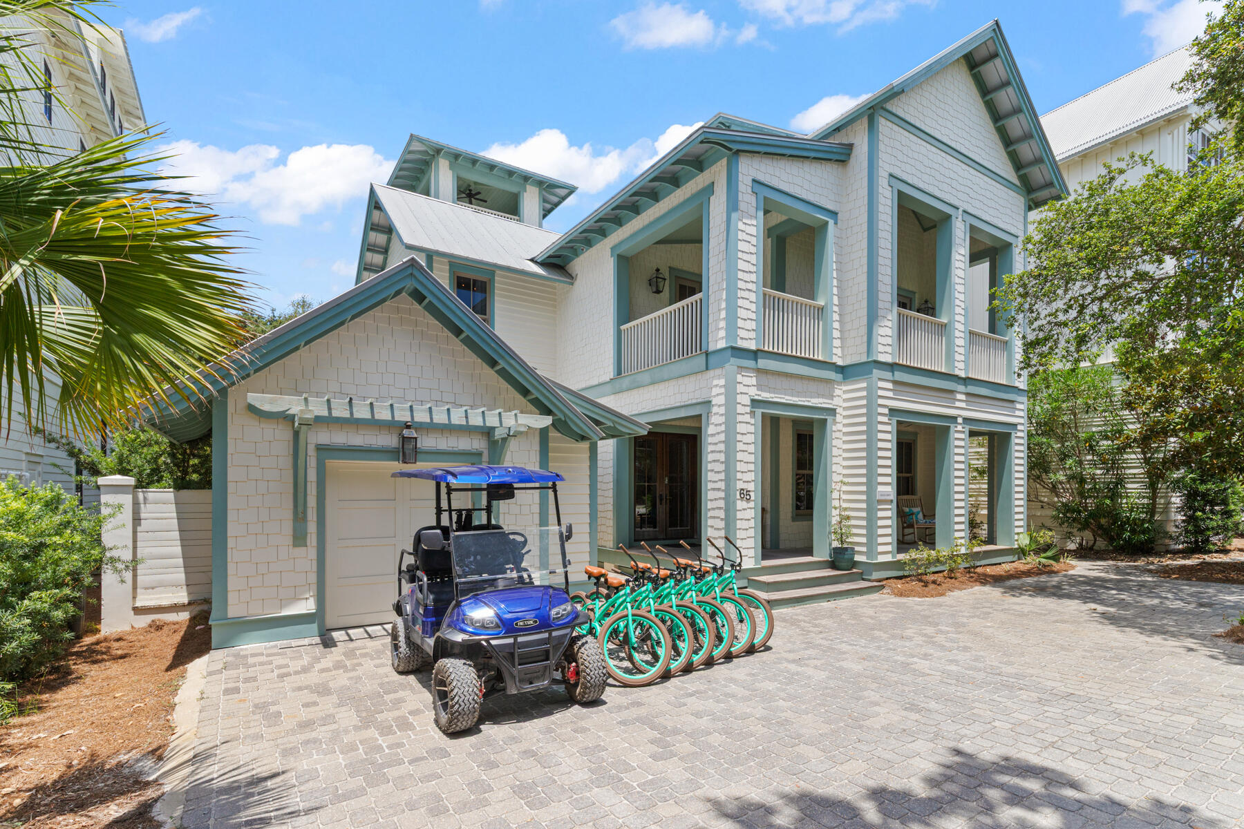 A timeless Old Seagrove retreat just steps from the Gulf, this spacious beach home offers the rare combination of classic coastal character, exceptional location, and outstanding rental potential. Nestled beneath mature trees on a quiet Seagrove street, the property sits just 350 feet from beach access and one block from Scenic Highway 30A, placing you within an easy walk or bike ride of Seaside and some of the most beloved dining and shopping along the Emerald Coast. Adding to its appeal, the property benefits from no HOA dues, a rarity in this highly desirable area.

Inside, the home blends warm architectural details with relaxed coastal design. Beamed pecky cypress ceilings, white oak floors, and crisp shiplap walls create an inviting interior that feels both refined and comfortable. Natural light fills the open-concept living and dining areas, while the spacious kitchen with premium appliances and generous seating is designed for gathering after long days at the beach.

Spanning three levels of living space, the layout offers room for everyone to spread out and relax. A third-floor bonus living area with kitchenette provides an additional lounge or game space, while the rooftop tower with wet bar captures views toward the Gulf, creating a unique spot to unwind and take in the coastal breeze. With accommodations for up to 16 guests, the home is ideally suited for large families and vacation groups alike.

Outdoor living is just as inviting. A large covered porch with outdoor kitchen overlooks the private pool, offering a natural gathering space for afternoons in the shade and evenings under the stars. Thoughtful features throughout the home include an elevator, three washers and dryers, garage parking, and generous storage, all designed to make extended stays and rental management seamless.

The location places you right in the center of the 30A lifestyle. The Surfing Deer, Seagrove Village Market, Cowgirl Kitchen, and Seaside Town Center are all within easy reach, while the surrounding communities of WaterColor, Grayton Beach, Alys Beach, and Rosemary Beach are just a short drive away.

This beach home is offered fully furnished with six bikes and a four-seat golf cart included, creating a true turnkey opportunity. With rental projections of nearly $275,000 per year, this property represents a compelling blend of lifestyle and investment in one of the most sought-after areas along Scenic Highway 30A.