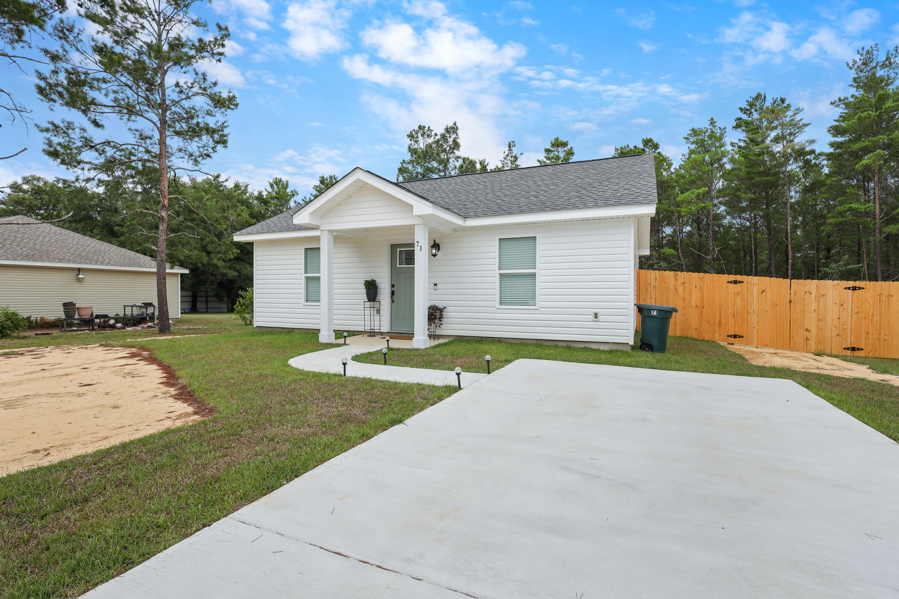 20% discount on the deposit for active military! Step into this beautifully built 2-bedroom, 1-bath home featuring quality finishes and a thoughtfully designed layout. The open-concept kitchen, dining, and living area offers a comfortable space for everyday living, complete with shaker-style cabinets, quartz countertops, and stainless steel appliances. The modern bathroom features matching quartz surfaces and stylish brushed bronze fixtures. Enjoy a covered back porch overlooking a spacious backyard with lush green grass perfect for relaxing outdoors. A full-size washer and dryer are available if needed for added convenience. A $50 application fee applies