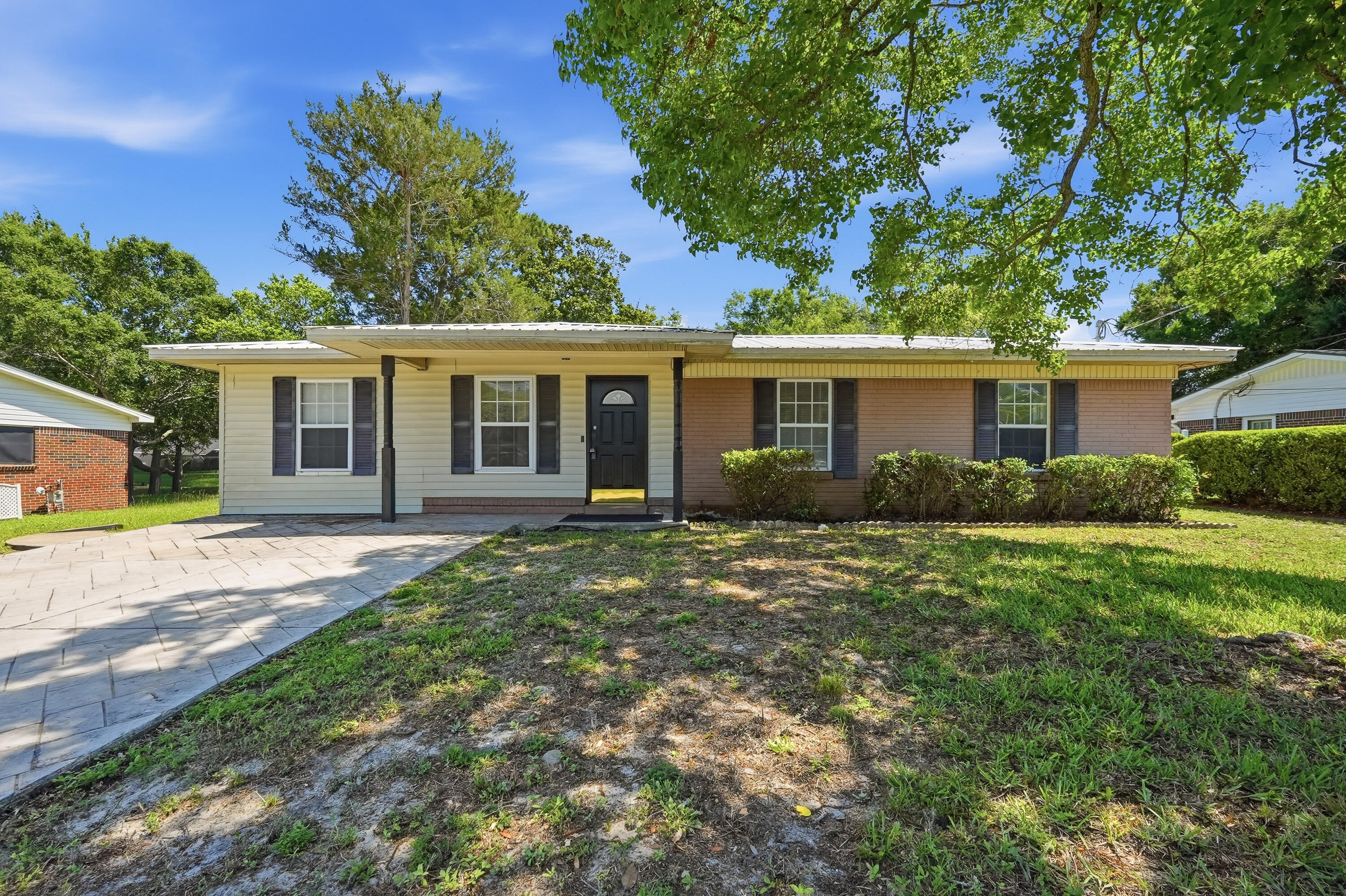 $20,000.00 price reduction.  Super location for this charming 3-bedroom, 1-bath home.  Home has 1,314 square feet of comfortable living space and is conveniently located near shopping, schools, employment centers, and the beautiful Emerald Coast beaches.  The updated kitchen features granite countertops, stainless steel appliances, and refreshed cabinetry, creating a stylish and functional space for everyday living. Additional upgrades include insulated Pella windows and fresh interior paint in today's popular Sherwin-Williams color palette.  The former garage has been converted into a spacious family room, providing additional living and entertaining space. Outside, you'll find an oversized stamped concrete driveway and a large backyard with plenty of room to add a pool, outdoor living area, or garden. Whether you're looking for a primary residence, vacation home, or investment opportunity, this property offers an unbeatable combination of location, updates, and value.