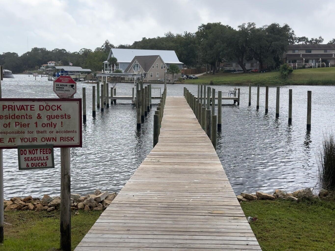 FIRST FLOOR 2/1 Fresh/Clean & Updated!  Full Sized Washer & Dryer Included!  Community Water access & Pool!  Convenient Location close to Beaches, Bases, Hospital, Lowes, Walmart & Sam's Club! The complex offers temporary boat slips on a first come basis, fishing dock and pool!  Tennis Court and waterfront pool overlooking scenic Cinco Bayou. Large living/dining room with Low Maintenance LVP Floors and a storage closet. The Updated, Eat-Kitchen opens to the back patio where you can roll your kayak straight down to the water!  2 Nicely sized Bedrooms and a Full Bath! Tile & LVP Flooring throughout! No Carpet! Easy Living! The community pool has also had recent upgrades and is located right next to the dock. One assigned parking space & overflow parking towards the front. A full size washer and dryer are included and the complex also has a nice, onsite laundry facility. This is a peaceful, centrally located condo for easy, low maintenance living! Minimum FICO Score of 640 is requested.
