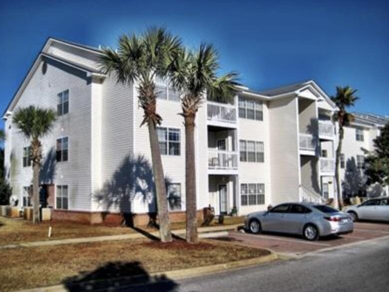 Spacious 2-bedroom, 2-bath second-floor unit located in prime Indian Lakes community. Close to beaches, dining, shopping, and shops.  The back porch oversees a quiet lake with several magnolias.  Inside, find tile floors and granite counters. The primary suite offers an en-suite bath and walk-in closet, while the second bedroom sits next to another full bath. Community amenities include a pool, playground, and fitness center. HOA includes Cox Cable. Buyer to verify all information.