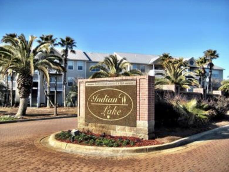 Spacious 2-bedroom, 2-bath second-floor unit located in prime Indian Lakes community. Close to beaches, dining, shopping, and shops.  The back porch oversees a quiet lake with several magnolias.  Inside, find tile floors and granite counters. The primary suite offers an en-suite bath and walk-in closet, while the second bedroom sits next to another full bath. Community amenities include a pool, playground, and fitness center. HOA includes Cox Cable. Buyer to verify all information.