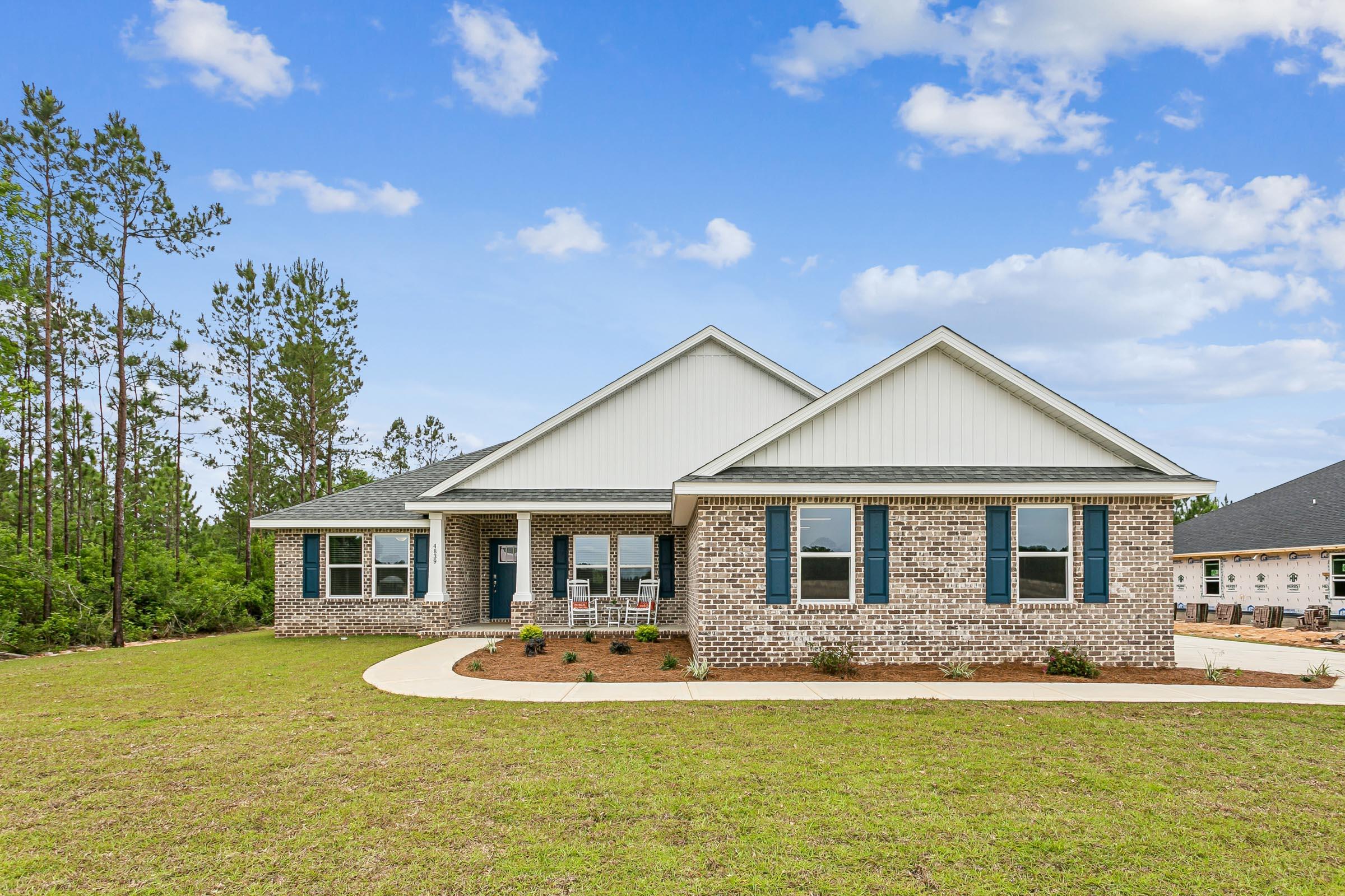 Welcome home to your new country estate for laid back living with all the conveniences of a modern, wonderfully built home. This stunning Turquoise Estate Floor Plan is situated on a private 1..05-acre estate lot in the Walther Reserve community in Milton. Offering 5 bedrooms, 3 full bathrooms this home blends modern convenience with spacious country charm. The oversized homesite is tucked away in a quiet, low-traffic street surrounded by nature, providing the perfect backdrop for privacy and peaceful living. Inside, the home showcases Herbst Homes' signature quality and attention to detail, with upscale features throughout. You'll find high-end cabinetry, granite or quartz countertops, and premium finishes that elevate every space. The kitchen is equipped with stainless steel appliances, under cabinet lighting, soft close cabinets, a walk-in pantry, all designed for both function and beauty. Additional upgrades include a whole-house blinds package, crown molding in the common areas, and durable luxury vinyl plank flooring. The spacious, split-bedroom layout includes a luxurious primary suite with a tray ceiling, tiled walk-in shower, garden tub, double vanities, and a generous walk-in closet. A side-entry three-car garage elevates curb appeal with a clean, upscale look while providing ample space and functionality. This home has it all! Pictures are of a similar home, colors may vary.  Projected completion is December 2026.