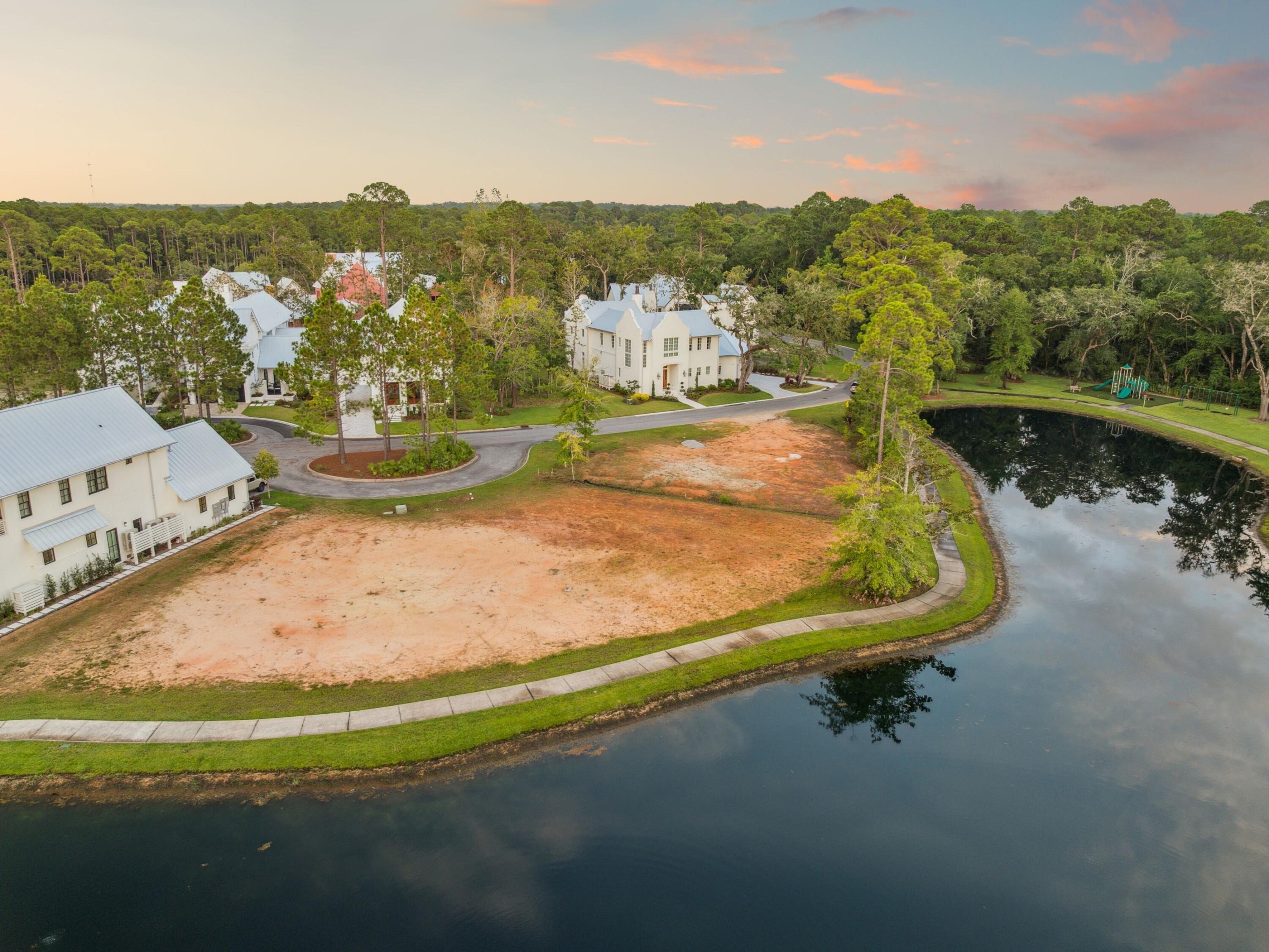 Welcome to Churchill Oaks, where timeless architecture meets modern coastal living. Lot 75A presents a rare opportunity to build a custom residence overlooking the community's serene coastal preserve within this sought-after gated enclave. A thoughtfully designed architectural plan has been envisioned for the property. The proposed home offers over 4,100 square feet of living space, featuring a four-bedroom, four-and-a-half-bath layout designed to blend refined interiors with relaxed coastal living. The concept includes an open-concept great room with vaulted ceilings and reclaimed wood beams, a marble-clad chef's kitchen with Wolf and Sub-Zero appliances, and seamless indoor-outdoor living with sliding glass doors leading to a covered patio and summer kitchen. The proposed main level includes a private primary suite with a spa-inspired bath, generous closet space, and views of the surrounding preserve. The upper level is designed to accommodate three guest suites, each with a private bath, along with a bunk nook and morning bar for added flexibility.

Exterior plans reflect painted brick construction, metal roofing, a private courtyard, and lush landscaping, along with a two-car garage and additional driveway parking. Buyers have the opportunity to personalize finishes and further tailor the design to their preferences.

Residents of Churchill Oaks enjoy gated security, a resort-style pool, clubhouse, fitness center, and access to the bay with potential dock slip availability, offering a refined coastal lifestyle.