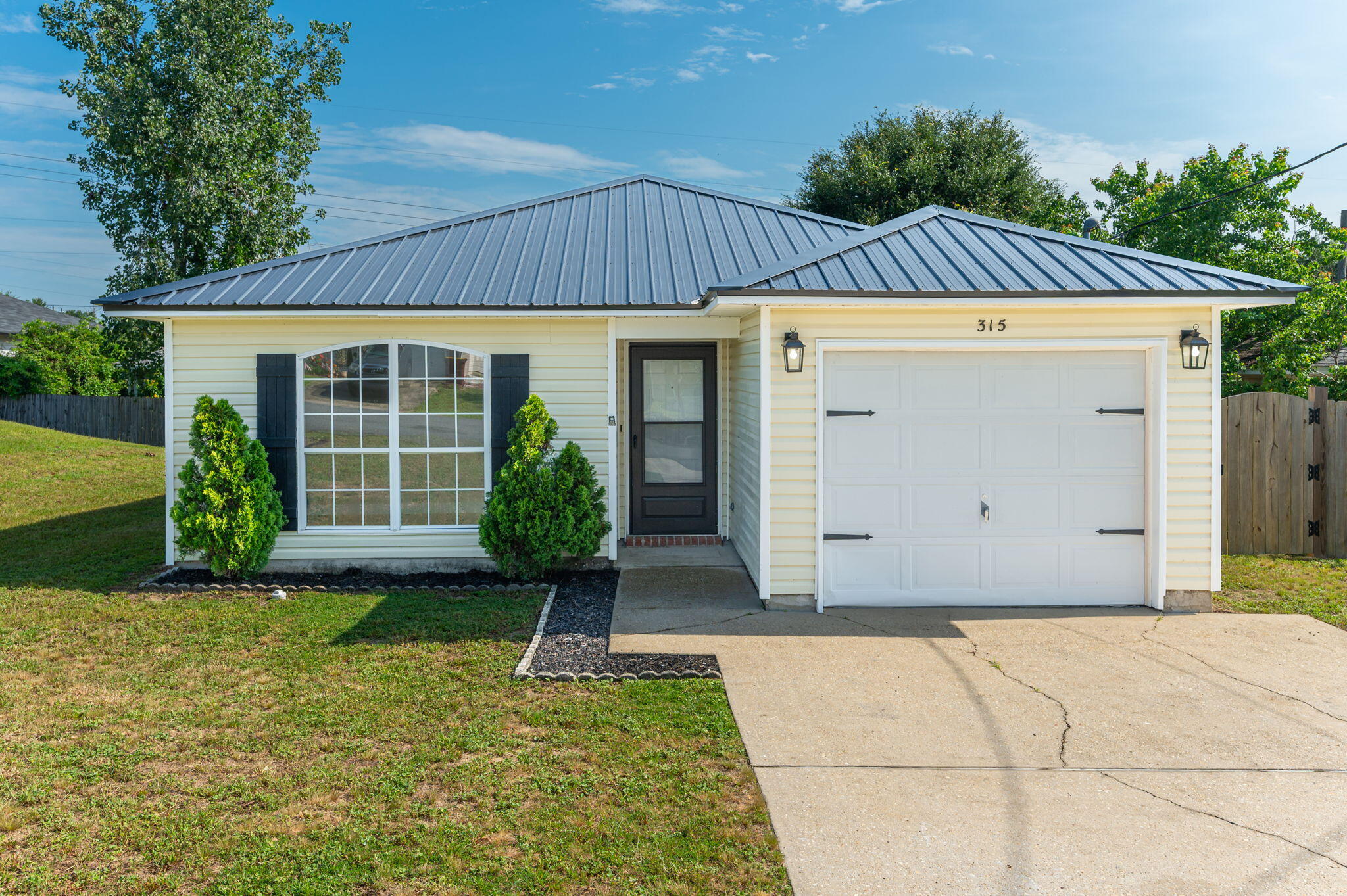 Move-in ready 3-bedroom, 2-bath home south of I-10 with approximately 1,400 square feet of living space. Recent updates include a new metal roof (2025), new interior paint throughout, new granite countertops, HVAC system (2023), and water heater (2021), giving buyers peace of mind for years to come. The open floor plan features a spacious living area, a kitchen with an island, laminate flooring throughout with no carpet, and plenty of natural light. Step outside to enjoy the backyard deck and low-maintenance yard--perfect for relaxing or entertaining. Conveniently located near shopping, dining, schools, and just minutes from I-10. Schedule your private showing today!