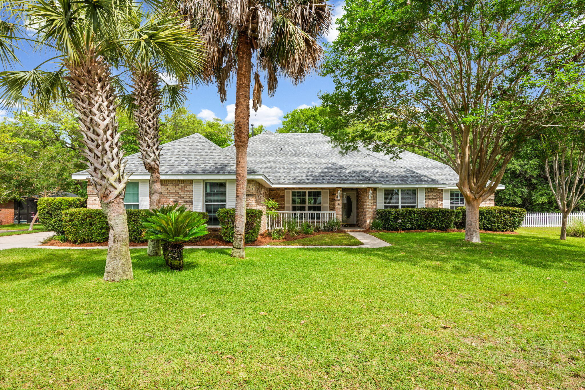 Welcome home to the winning combination of warmth, style, and worry-free living on William Faulker! Nestled within the sought-after community of Bluewater Bay, this beautifully maintained single-story brick home offers the perfect blend of comfort, style, and functionality. Spanning 2,281 square feet, the home lives exceptionally well and features two versatile bonus spaces at the front of the home--ideal for a home office, gym, playroom, homeschool room, formal dining area, or additional living space. Beyond the spacious foyer, you'll find an oversized family room highlighted by vaulted ceilings and a cozy gas fireplace. The updated kitchen features granite countertops, stainless steel appliances, and space for gathering and meal preparation. 

A desirable split-bedroom floor plan offers privacy, with the primary suite situated separately from the remaining three bedrooms and full guest bath. Additional features include a quiet cul-de-sac location, fenced backyard with added privacy, gated community access, side-entry garage, and a charming patio complete with a lighted pergola. Gas appliances--including the furnace, water heater, dryer, and fireplace--add both efficiency and convenience. Updated fixtures, large rooms, and the absence of popcorn ceilings further elevate the home's modern appeal.

This exciting property is zoned for Niceville High school, Ruckel or Destin Middle school and the A+ rated Bluewater Elementary -- schedule your private showing today! 

Roof 2024, WH 2018, HVAC condenser 2024/furnace 2012 and windows 2015.