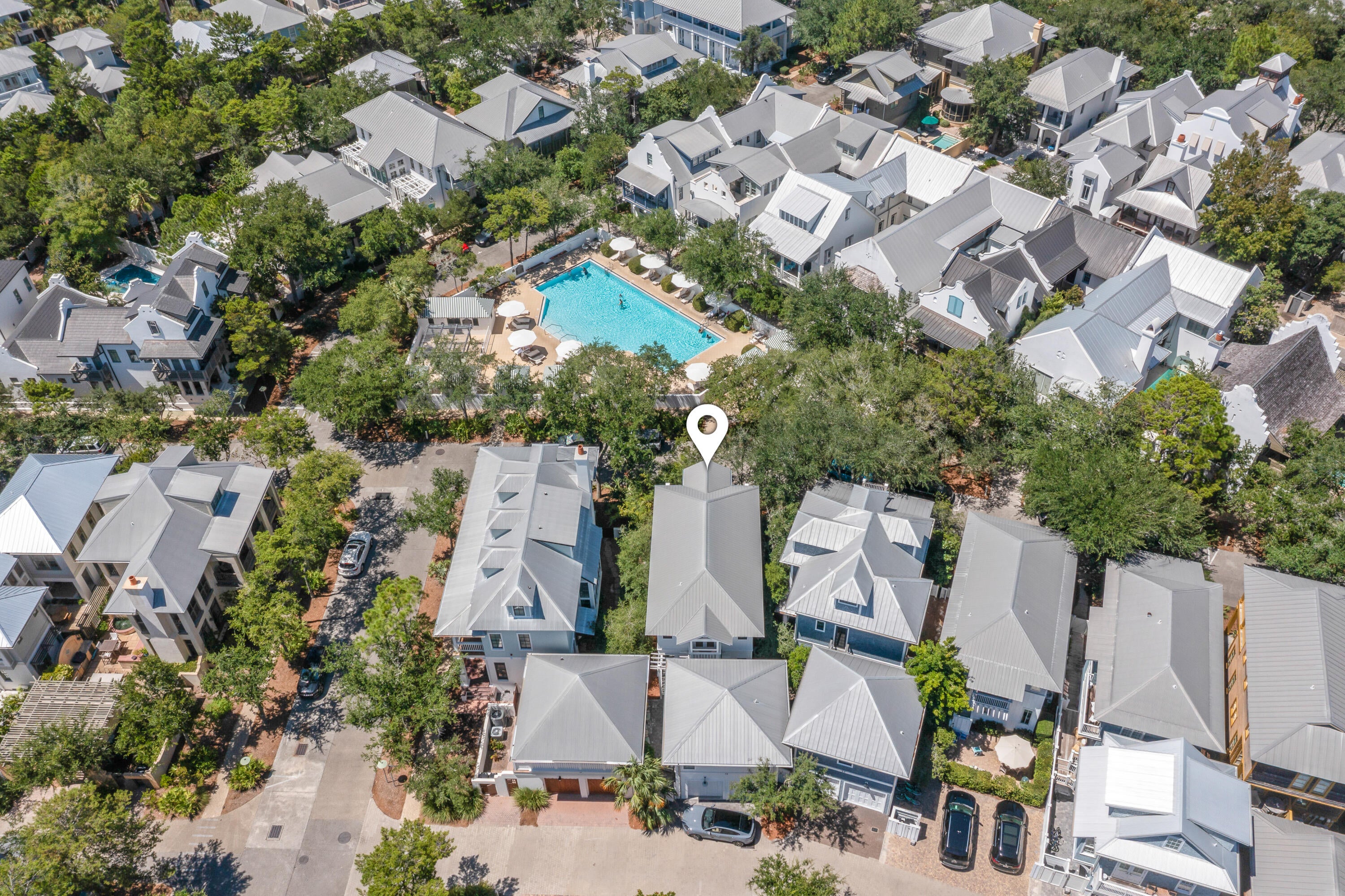 Located in the heart of Rosemary Beach, this 5-bedroom, 5-full-bath home offers 2,348 square feet of comfortable, well-designed living space in one of 30A's most desirable communities. Used as a second home and well cared for, the property is in excellent condition and ready for its next owner.

Situated directly across from one of Rosemary Beach's community pools, the location is hard to beat. The beach is just a short stroll away, while Rosemary Beach's restaurants, boutiques, and town center are all right outside your door. It's the kind of location that makes it easy to park the car and enjoy everything Rosemary Beach has to offer.

One of the standout features of this home is the two-bedroom carriage house, offering plenty of flexibility for family and guests. It's a great space for visiting friends, extended family, or simply giving everyone a little extra privacy. The home also offers newly updated bathrooms, two private balconies, perfect for enjoying the coastal breeze, as well as an outdoor shower for an easy rinse after a day at the beach.

With its prime location, flexible living spaces, and well-maintained condition, this is a wonderful opportunity to own a second home in the heart of Rosemary Beach.

Information contained within this listing such as lot dimensions, is deemed to be accurate but is not guaranteed. Buyer to verify.