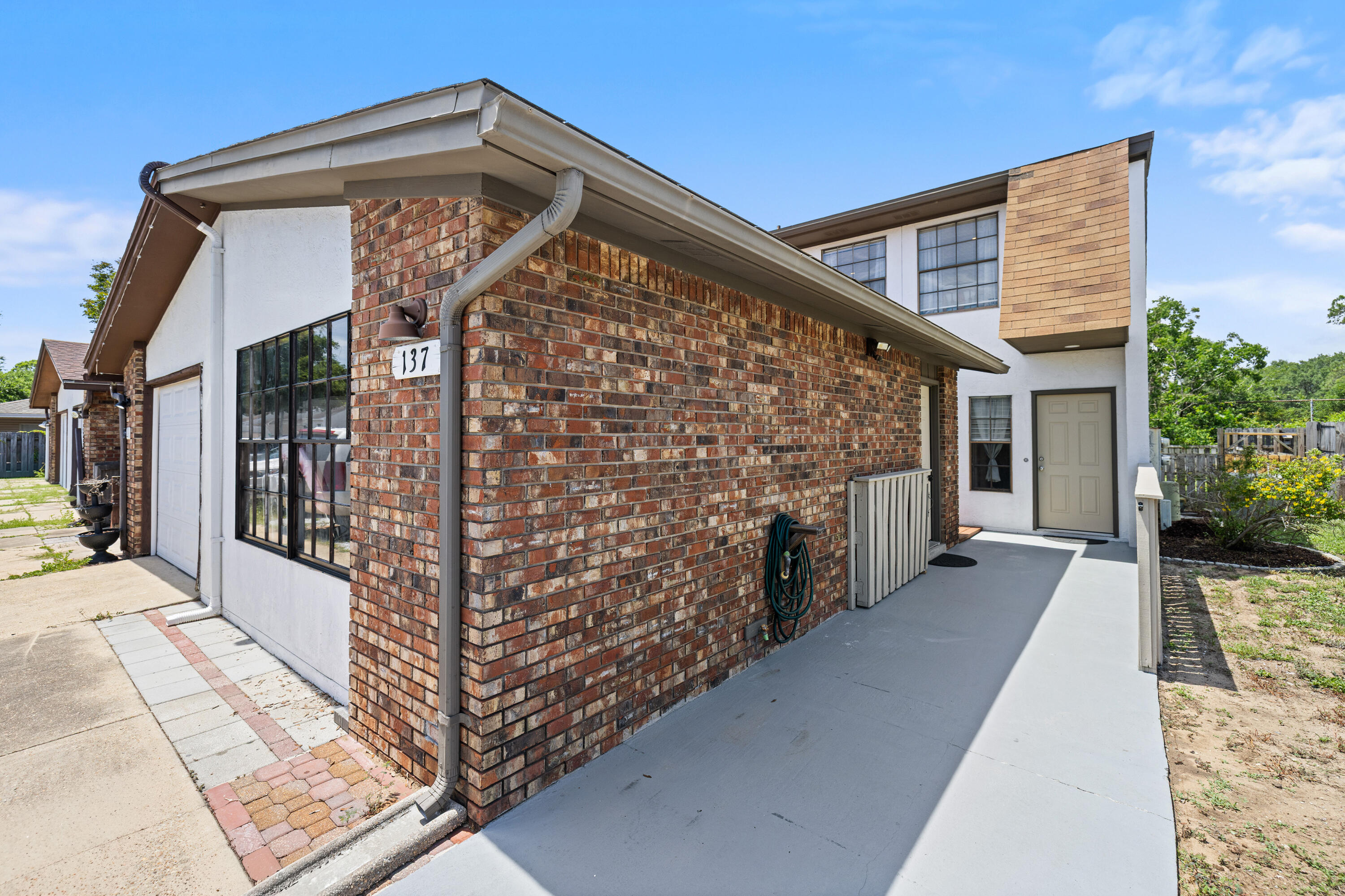 Welcome home to this meticulously maintained 3 bedroom 2.5 bathroom townhome with NO HOA that truly reflects pride of ownership throughout. Thoughtfully updated with stylish finishes and modern touches, this move-in ready property offers the perfect blend of comfort, functionality, and convenience. The spacious floor plan features a heated and enclosed flex space that can easily serve as a home office, workshop, fitness area, playroom or whatever suits your lifestyle. The beautifully renovated interior showcases an updated kitchen and baths, flooring, fixtures, paint and finishes throughout creating a fresh and inviting atmosphere. Step outside from the living room to the impeccably maintained screened in patio, the perfect place to enjoy your morning coffee, unwind after a long day, or entertain guests year round.  Beyond the patio, you'll find a nicely fenced backyard offering a private outdoor retreat with plenty of space for gardening, relaxing and letting your furry friends play safely.  Enjoy the convenience of living in the heart of Shalimar, just minutes from schools, military bases, shopping, parks and the beautiful Emerald Coast beaches. Whether you're looking for a primary residence, second home, or investment opportunity, this exceptional townhouse offers versatility, charm and a location that's hard to beat!  Schedule your showing today!