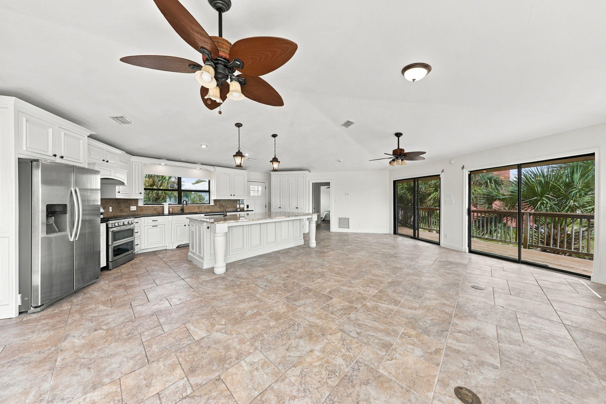 Approximately 639 feet from public beach access leading to the sugar-white sand and Gulf, this freshly updated coastal retreat offers Gulf views, a private pool, and more than 1,600 square feet of outdoor living space. The interior has been refreshed with new coastal-inspired wall colors and freshly painted kitchen cabinetry, creating a bright, clean look that complements the home's natural light and island setting.

Located in one of Okaloosa Island's most desirable residential neighborhoods, where short-term vacation rentals are not permitted, the property offers a rare combination of beach proximity, privacy, and relaxed coastal living.

More than 1,000 square feet of elevated decking, along with additional covered outdoor areas and patio space, provides multiple places to enjoy Gulf breezes, sunrises, sunsets, and gatherings with family and friends.

Inside, the spacious open-concept floor plan is designed for comfortable everyday living and easy entertaining. The chef's kitchen features freshly painted custom cabinetry, abundant storage, granite countertops, and an impressive 8-foot by 11-foot center island topped with a single slab of granite. Walls of windows fill the living areas with natural light while capturing views toward the Gulf.

The home also features an owned solar energy system that is included in the sale, allowing the new owner to enjoy the benefits of solar without assuming a solar lease.

 After a day at the beach, relax beside the private pool, entertain on the expansive decks, or take a short stroll to nearby Santa Rosa Sound access for paddleboarding, kayaking, fishing, and boating. The generous corner lot provides additional privacy and outdoor space rarely found this close to the beach.

Unlike many beach communities, this neighborhood offers a quieter residential atmosphere without the constant turnover of weekly vacation rentals. Dining, shopping, entertainment, and area attractions are all conveniently nearby.

Whether you are searching for a primary residence, second home, or family beach retreat, this property offers Gulf views, public beach access, a private pool, extensive outdoor living space, an owned solar energy system, and a freshly updated coastal interior in one of Okaloosa Island's most sought-after locations.