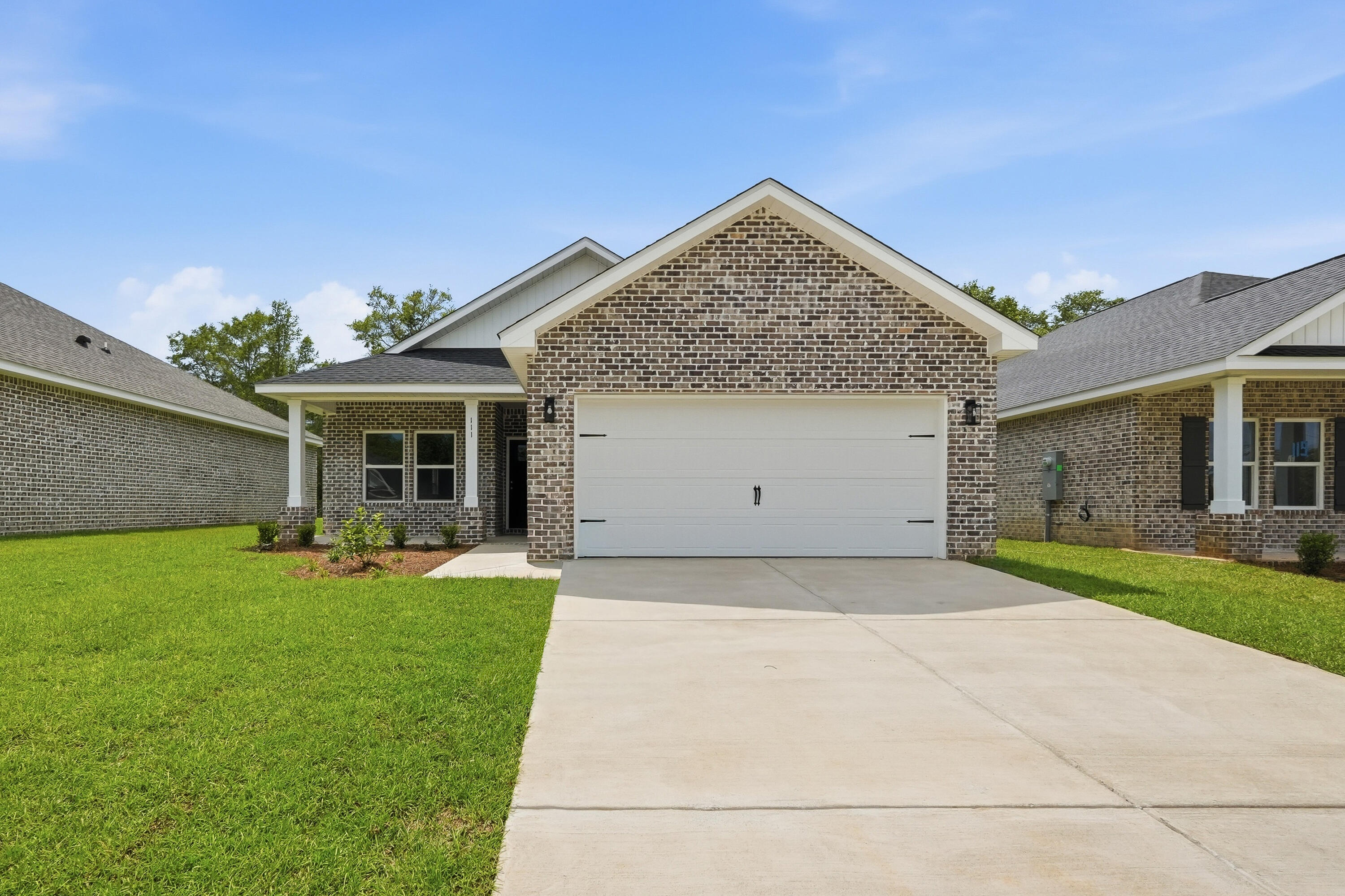 FLEXIBLE FOUR BEDROOM 'GEORGIA' PLAN Construction Complete!  All brick construction with finished 2-car-garage, landscaped yard.  Located in the new 'McCarthy Estates' S/D with easy access to Walton High School.  Seller will contribute up to $15,000 towards buyers closing costs/prepaids/rate buydown (call for details). MUST CLOSE BY AUGUST 31, 2026. Neighborhood features include underground utilities, sidewalks, mailbox center and 1 beautiful street!  Cozy dining nook, breakfast bar w/seating, pantry + quartz countertops, family gathering room overlooks back porch, split bedroom plan.  Owner's suite has walk-in closet, double vanities, linen storage & shower only. Vinyl plank flooring in common areas, recessed lighting, raised ceilings.