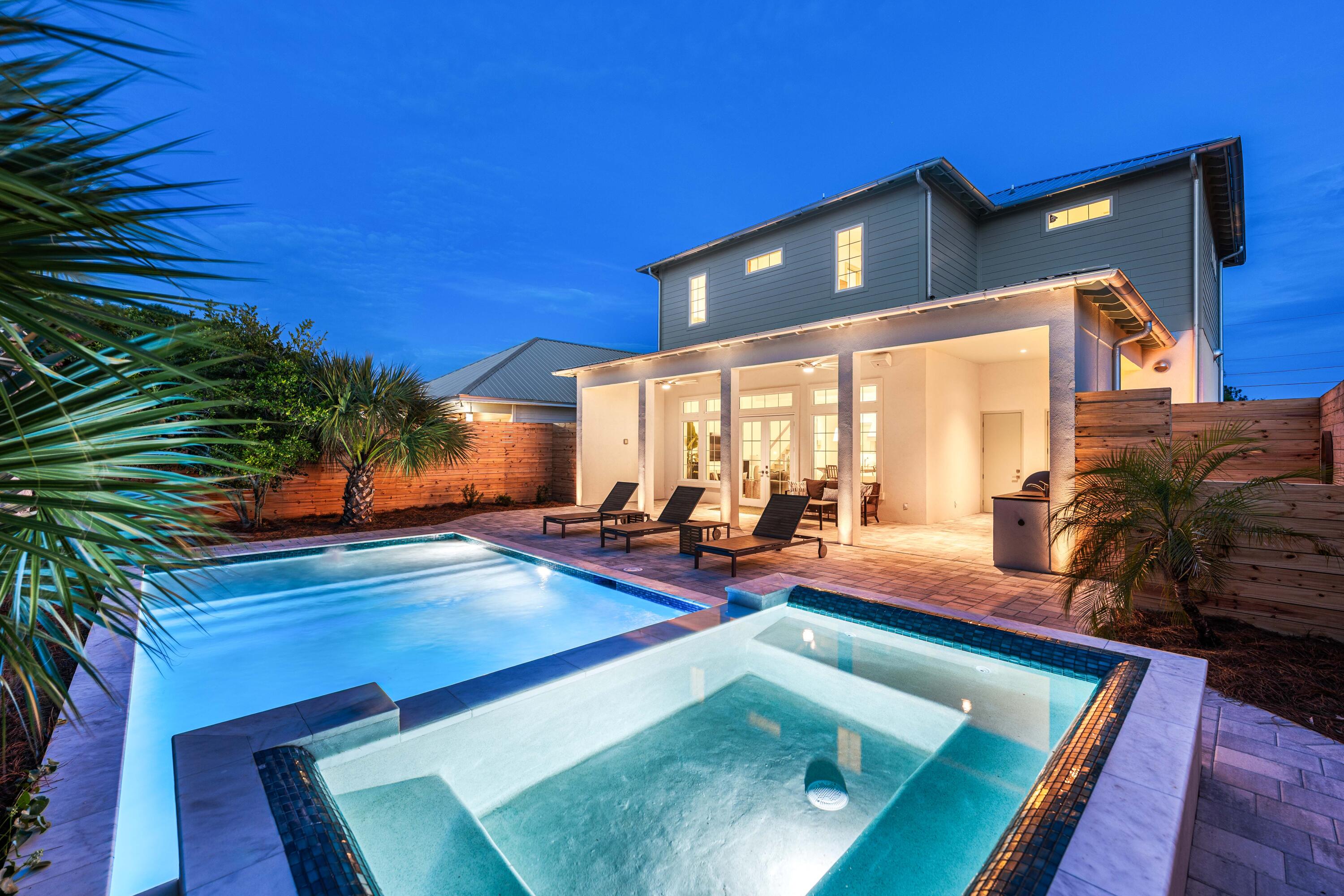 317 Le Grand Drive was built on a simple idea: a beach house shouldn't have to choose between effortless and exceptional.

Five bedrooms, four and a half baths plus a half bath off the pool, 2,572 square feet, sleeping up to 12 - this is a brand-new build designed around the way people actually want to spend a week at the beach. Mornings start on one of two covered balconies with Gulf views, close enough to the water to hear it roll in while the coffee's still hot, and the beach itself is a golf cart ride away, about a minute down the road, in a neighborhood built for exactly that pace. The rest of the day plays out around a heated saltwater pool and spa with a tanning ledge and custom seating, a summer kitchen and grill, and a patio wired for outdoor sound. A one-car garage plus five additional parking spaces means the whole group arrives - cars, golf cart, and all - without anyone circling the block.
Inside, the details do the talking. White oak floors run through the upstairs living spaces, the kitchen centers on a ten-foot quartzite island anchored by Fisher & Paykel professional-grade appliances, and the primary suite is finished in marble from floor to shower. An outdoor shower off the pool deck keeps sandy feet from ever making it past the door. Designer lighting and quality furnishings carry that same level of care into every room, and the home is sold fully furnished, right down to the tools in the garage - an owner or a guest can walk in and start enjoying it immediately, whether that's the first night of ownership or the first night of a rental booking.

What sets this house apart, though, is what a typical buyer never thinks to ask about until it's missing. The building envelope is fully sealed - hurricane-rated impact windows and doors, sealed sheathing and drainage layers built to shrug off salt air and storms, and a permanent termite pretreatment poured directly into the slab. Every interior wall carries sound-dampening insulation, so the house is as quiet inside as it is solid outside. For anyone who pays attention to what they're breathing, there's a dedicated fresh-air system pulling filtered outside air through the home around the clock, paired with a whole-house dehumidifier that keeps humidity and moisture in check year-round. That same forward-thinking carries into the everyday conveniences - whole-home WiFi and wired Cat6 connectivity, 24/7 security cameras with no subscription required, and power already run to the garage for an EV charger. This is a house built by someone thinking about year twenty, not just the open house.

Location is where this address really sets itself apart. Pier Park is fifteen minutes away, with its shopping, waterfront dining, Topgolf, and a Pirates Voyage dinner show that becomes the story of the trip. Ten minutes the other way down 30A leads to Rosemary Beach and its neighboring villages, known for boutiques, restaurants, and coastal design. Two of the Gulf Coast's best days out, both close enough to fit into an ordinary week here rather than a special occasion.

That combination - genuine walk-to-golf-cart beach access, a house engineered for air quality and built to outlast decades of coastal weather, and a location that pulls equally from Panama City Beach's biggest attractions and 30A's polish - is what elevates this property from a beach house into an asset built to perform for as long as you own it. 317 Le Grand Drive is the kind of new construction that gets better the longer you look at it, built to be lived in, rented, and enjoyed for decades to come. Schedule your private showing and see firsthand why this address sets the standard every other listing on this coast will be measured against.
