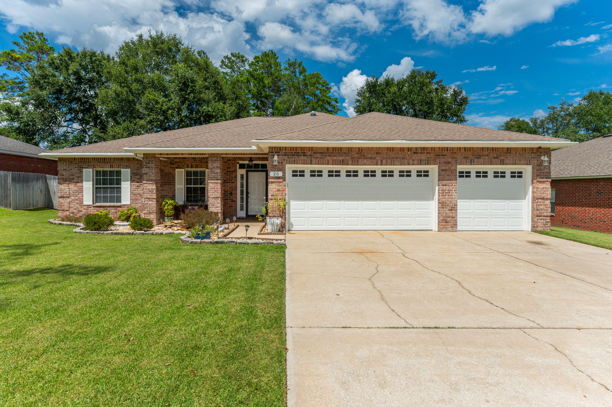 Welcome to 25 Magnolia Lake Drive in Magnolia Lake Estates. This beautifully maintained brick home offers 4 bedrooms, 3 full bathrooms, and a spacious 3 car garage, along with generous storage and a layout designed for everyday comfort and entertaining.

The open living, dining, and kitchen areas create a natural gathering space with a functional flow and defined areas for cooking, dining, and relaxing. The split bedroom floor plan provides added privacy, with the primary suite set apart as a comfortable retreat, ideal for guests, a home office, or a growing household.

Outside, enjoy a privacy fenced backyard and a large screened in patio that extends the living space outdoors. Patio access from the primary bedroom, living room, and a full bathroom makes indoor outdoor living easy for grilling, relaxing, or hosting.

Magnolia Lake Estates offers a peaceful neighborhood setting with community amenities including a lake, fishing dock, and pavilion. Conveniently located within walking distance to Maude Saunders Elementary, Walton High School, Emerald Coast Technical College, and Wee Care Park. Schedule your private tour today.