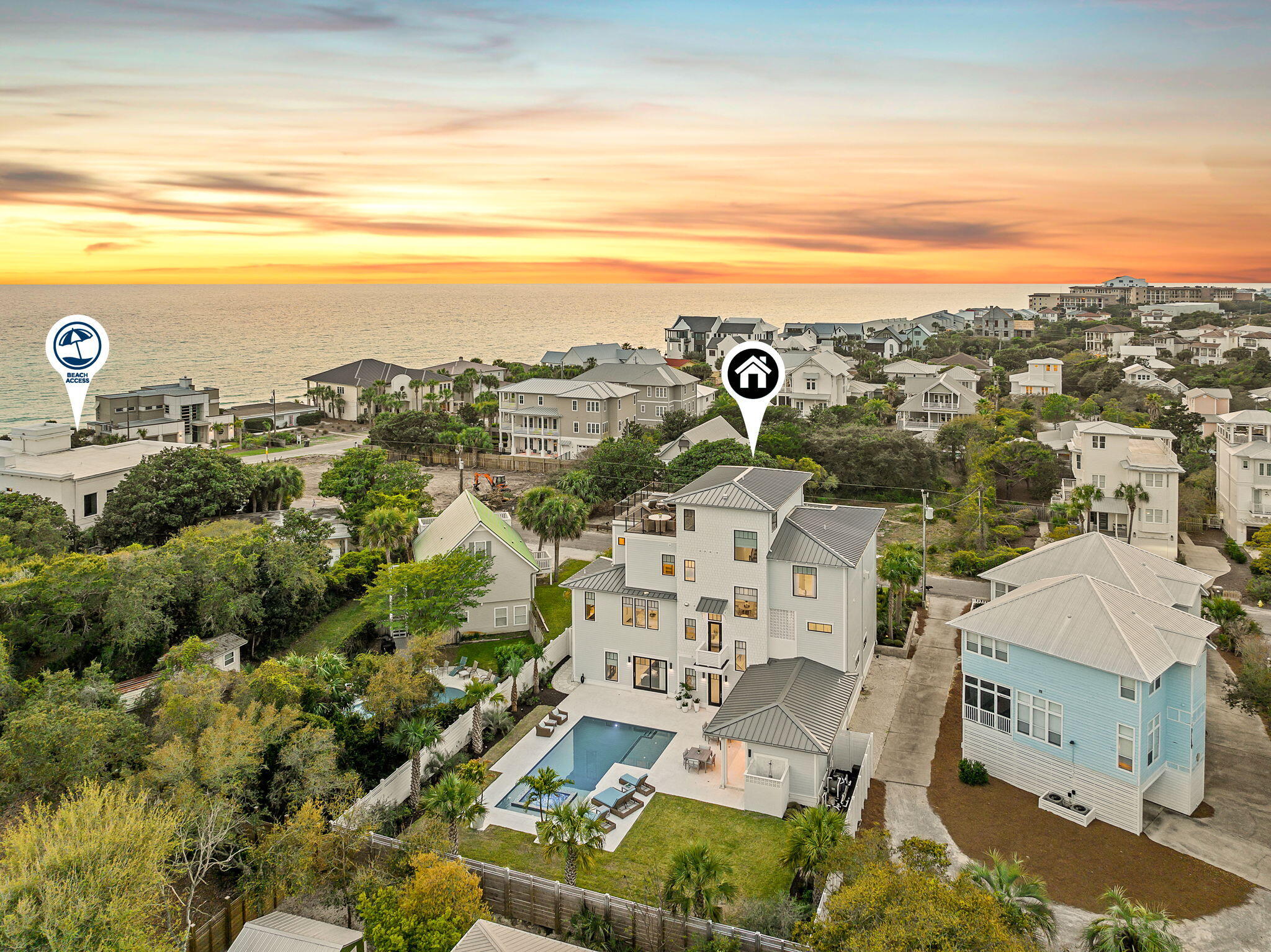 In the heart of Blue Mountain Beach, where the pace slows and the landscape feels more residential than resort-driven, 153 Gulf Point Road introduces a newly built coastal compound designed for both scale and livability. Set back on a rare 0.4-acre homesite along Scenic Highway 30A, the property feels intentionally removed from the road, framed by mature landscaping and established trees that create a sense of arrival more often associated with legacy homes than new construction. The experience begins outdoors. The rear of the property opens into a private, resort-like setting, where a saltwater pool with spillover spa anchors the space. An expansive terrace creates multiple zones for gathering, while the fully fenced yard adds both privacy and functionality. The breezeway connects the main residence to the outdoor living areas in a way that encourages movement between spaces, allowing days to unfold naturally between sun, shade, and water.

Inside, the home balances scale with thoughtful detail. The layout is expansive yet intentional, designed to accommodate both large gatherings and quieter retreats. Two primary suites provide flexibility for owners and guests, while the overall flow emphasizes comfort without sacrificing architectural presence. There are moments throughout the home that feel distinctly considered, including an outdoor shower connected to the primary bath that creates a seamless transition from beach to living space. Fully furnished interiors allow for immediate use, reinforcing the idea of the home as a finished, ready-to-enjoy environment rather than a project. Practical elements, including tankless water heaters, dual HVAC systems, and a two-car garage, support long-term ownership and everyday ease.

One of the most compelling features of the home unfolds at the top level. The rooftop deck is designed as a true entertainment space, capturing Gulf views and coastal breezes from an elevated vantage point rarely achieved in this part of Blue Mountain Beach. It functions as an outdoor living room in the sky, ideal for sunset gatherings, morning coffee, or evening dining under the open air. From this perspective, the surrounding canopy of trees gives way to glimpses of the Gulf, creating a layered view that blends privacy with the coastal setting.

Ownership includes deeded beach access to the Blue Mountain Beach shoreline, offering approximately 3,000 feet of linear Gulf frontage. This expansive stretch of sand is one of the defining characteristics of Blue Mountain Beach, known for its width, depth, and noticeably less crowded atmosphere. The scale of the access allows for a more relaxed experience, with ample room for recreation, long walks along the water, and uninterrupted views of the Gulf.

Beyond the property, the lifestyle of Blue Mountain Beach defines the experience. Local dining, beach access, and neighborhood conveniences are all nearby, yet the setting retains a quieter, more residential character along 30A. It is a place where mornings begin with a bike ride to the beach, afternoons settle around the pool, and evenings extend upward to the rooftop deck as the light fades over the Gulf.

153 Gulf Point Road feels less like a typical beach house and more like a private coastal estate, newly built but grounded in the kind of space, privacy, and architectural intention that rarely comes together in the center of Blue Mountain Beach.