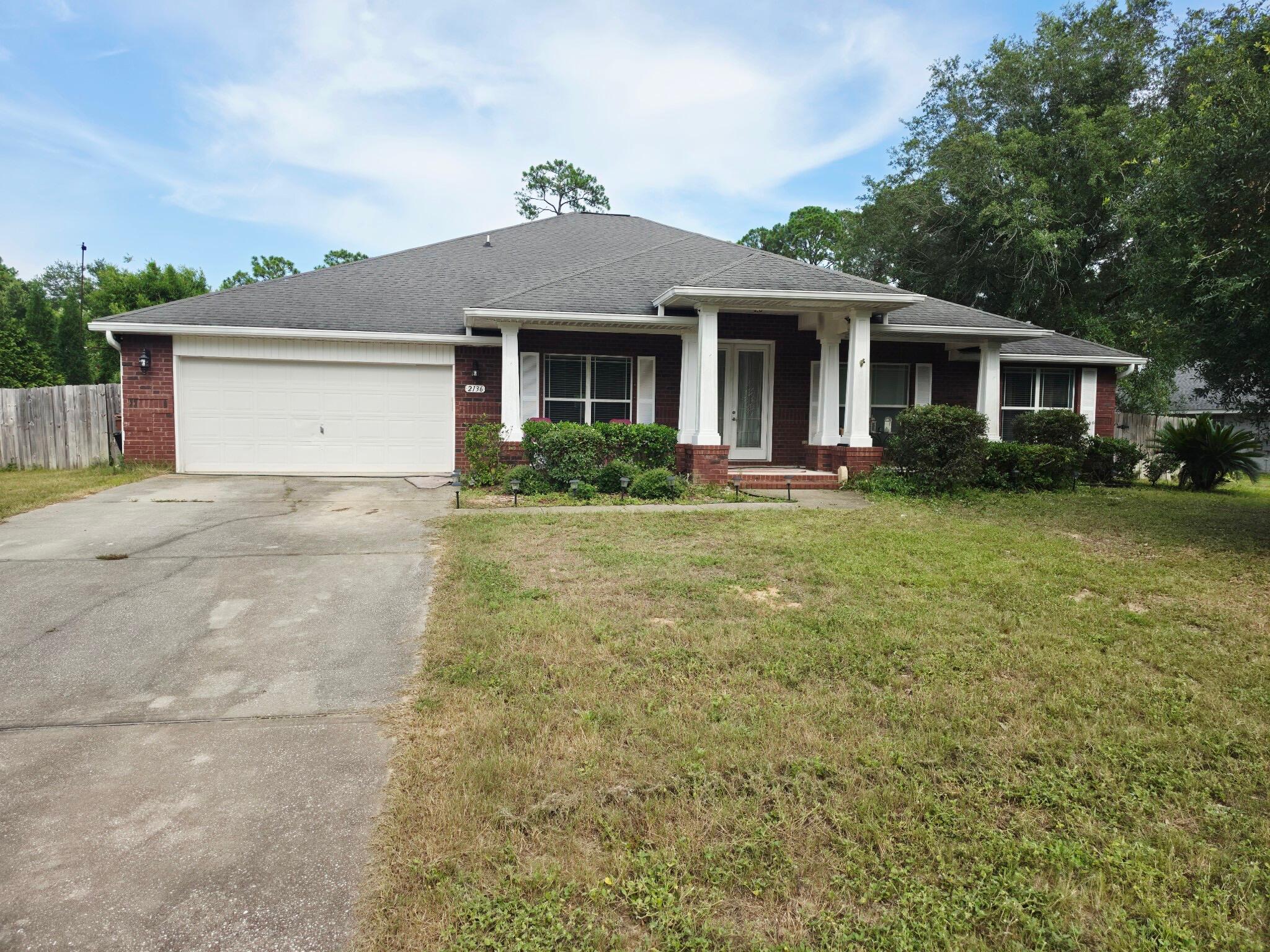 Welcome to your private resort-style escape in the heart of Navarre! This spacious pool home offers incredible potential, great bones, and a lifestyle built for entertaining, relaxing, and making memories. Step through the oversized covered front porch and 8' double glass doors into a bright, open layout featuring 10' ceilings, recessed lighting, detailed tile work, and a spa-inspired primary bath with a beautifully tiled walk-in shower. The chef's kitchen sits at the center of the home with a large island breakfast bar, downdraft range, and double ovens, flowing seamlessly into the dining and living areas for easy entertaining. Out back, enjoy your own private oasis with a heated saltwater gunite pool and spillover spa, perfect for year-round use. One of only two homes with this unique floor plan, offering rare design and character. Home is being sold **AS IS** and will require some cleanup and updating. The owners are making efforts to improve the pool and yard prior to closing, offering buyers an excellent opportunity to personalize the home while building equity.