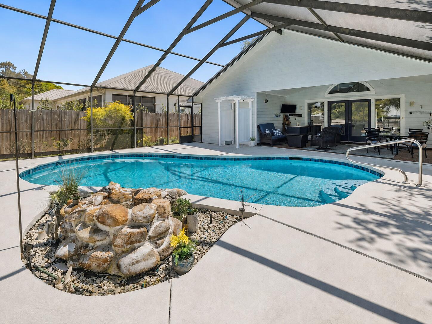 Welcome to coastal luxury in the charming, non-rental community of Seabreeze. This stunning residence captures the true essence of Gulf Coast living, ideally located along iconic Scenic Highway 30A in the heart of Seacrest. Just a three-minute stroll from the neighborhood's deeded, gated beach access, you'll find yourself on the sugar-white sands overlooking the emerald waters of the Gulf -- a true slice of paradise.
This meticulously maintained home offers 3 bedrooms, 2 full bathrooms, and a half bath, with extensive renovations completed between 2021 and 2023 for peace of mind. Major updates include a new roof, HVAC system, 75-gallon water heater, fresh interior and exterior paint, screened pool enclosure, new pool pump and cell, outdoor shower, updated sprinkler system with new Flotec motor and Rain Bird controller, and beautifully renovated kitchen and bathrooms.

The first level features two spacious, light-filled living areas, ideal for both relaxing and entertaining. The gourmet kitchen is a chef's dream with high-end appliances, a smart refrigerator, elegant quartz countertops, and abundant storage. Also on the main floor, the primary suite offers comfort and convenience with a fully updated ensuite bath showcasing modern finishes.

Upstairs, a versatile sitting area or home office leads to two additional bedrooms and a fully updated guest bath. With secondary bedrooms located on the upper level, the thoughtful layout provides added privacy for family and guests.

Outdoor living truly sets this property apart. The resort-style pool shimmers under the Florida sun, enhanced by a waterfall feature and a newly updated screened enclosure for year-round enjoyment. The spacious lanai creates the perfect setting for entertaining or relaxing, seamlessly blending indoor comfort with outdoor beauty. Beyond the screened area, generous green space provides room for games, gatherings, or quiet evenings around a fire pit.

The grounds feel like a private garden retreat, featuring fruit-bearing trees including orange, lemon, fig, blueberry, and olive- a special touch that enhances the home's coastal charm.

Residents of Seabreeze also enjoy access to a scenic community trail on the west side of the neighborhood, leading to a canoe and kayak launch on Camp Creek Lake, complete with a dock- perfect for peaceful sunset views over the water.

This Seabreeze gem combines luxury, location, and lifestyle, offering the ideal setting for creating unforgettable memories along 30A.

Home is being sold furnished with a few exceptions. Please see documents section for details. Dimensions, Square footage, & lot size are approximate and should be verified by buyer.