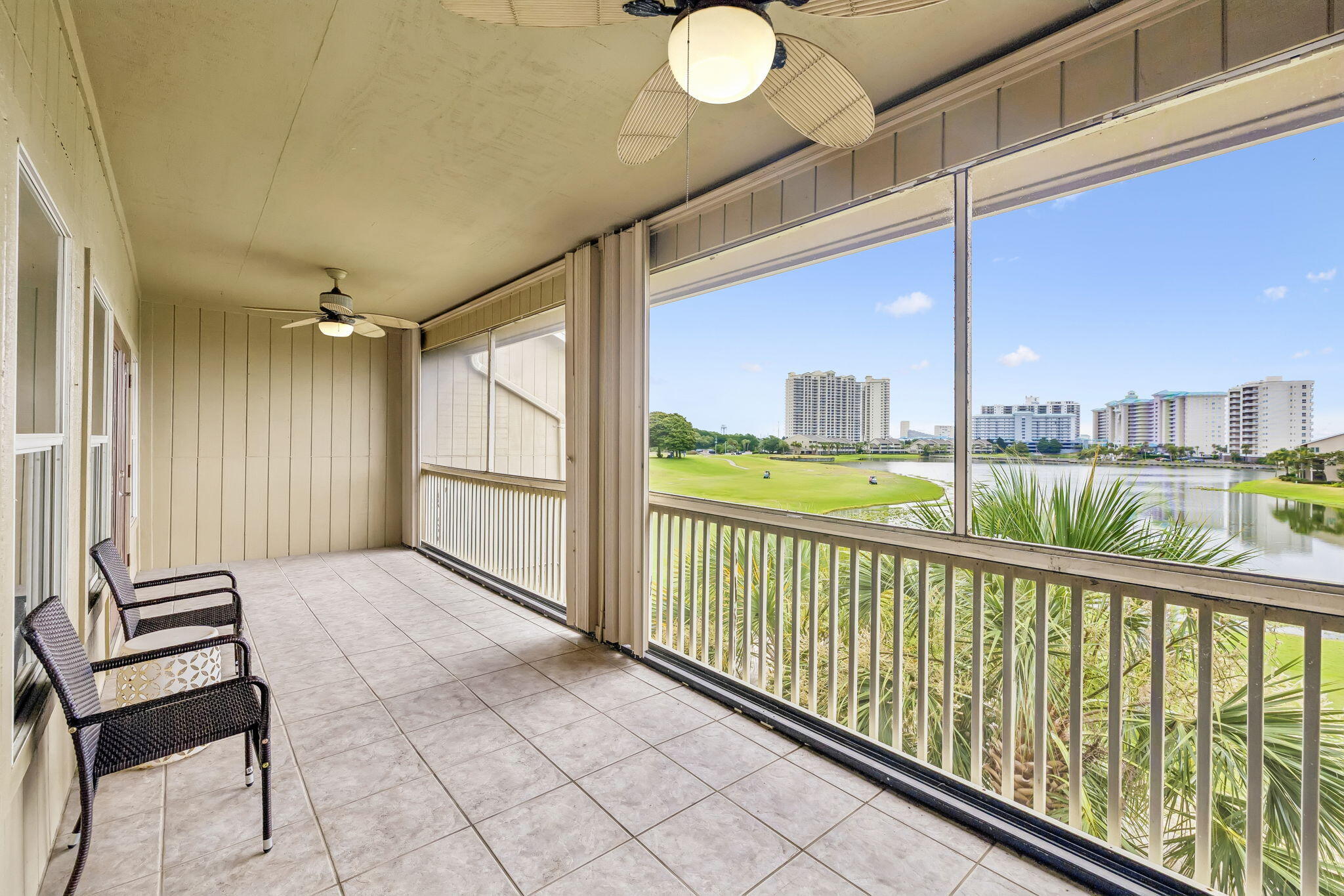 Tucked within the lush grounds of Seascape Resort and just a short stroll from the sugar-white sands of the Gulf, this beautifully maintained and fully furnished three bedroom, three bath residence offers an exceptional blend of privacy, space, and coastal convenience. Overlooking the 14th tee and fairway with tranquil Stewart Lake beyond, the home captures serene golf course and lake views stretching across Scenic Gulf Drive to a glimpse of the emerald waters of the Gulf.
Designed to live more like a private home than a condominium, this spacious two story residence features the largest three bedroom floor plan in Seascape Condos, spanning over 2,000 square feet and showcasing two expansive screened balconies, each equipped with retractable hurricane screens and positioned to maximize the peaceful setting. Offered fully furnished and turnkey, the residence features well-appointed coastal interiors, timeless finishes, and durable tile and wood-look luxury vinyl plank flooring, creating an inviting retreat designed for effortless beachside living and making it equally suited for full-time living, a second home, or a vacation rental investment.
The open living and dining areas flow effortlessly to the main level balcony, creating a seamless indoor-outdoor living experience while framing picturesque views of the golf course and lake beyond. The kitchen is appointed with granite countertops, LG stainless steel appliances, a Frigidaire refrigerator, generous workspace, and a breakfast bar ideal for casual gatherings.
Occupying the entire second floor, the private primary retreat offers a spacious sitting area, dual walk-in closets, an oversized bath with double vanities, a soaking tub and separate shower, and direct access to its own screened balcony where the peaceful views provide the perfect backdrop for morning coffee or evening sunsets.
Two guest suites are thoughtfully located on the first floor, both with en suite baths, including one with hallway access and another featuring a spacious walk-in closet. A dedicated laundry room with additional wire shelving and generous storage adds everyday convenience.
Residents enjoy access to Seascape's 300-acre resort setting with 2,000 feet of white sand beach, a beautiful golf course, tennis and pickleball facilities, multiple pools, and the vibrant Seascape Towne Centre with dining, shopping, and entertainment just a short golf cart ride away. A short stroll from the beach and ideally situated in the heart of Miramar Beach, the property is moments from Grand Boulevard, Silver Sands Premium Outlets, Destin Commons, and some of the Emerald Coast's most celebrated restaurants and attractions.