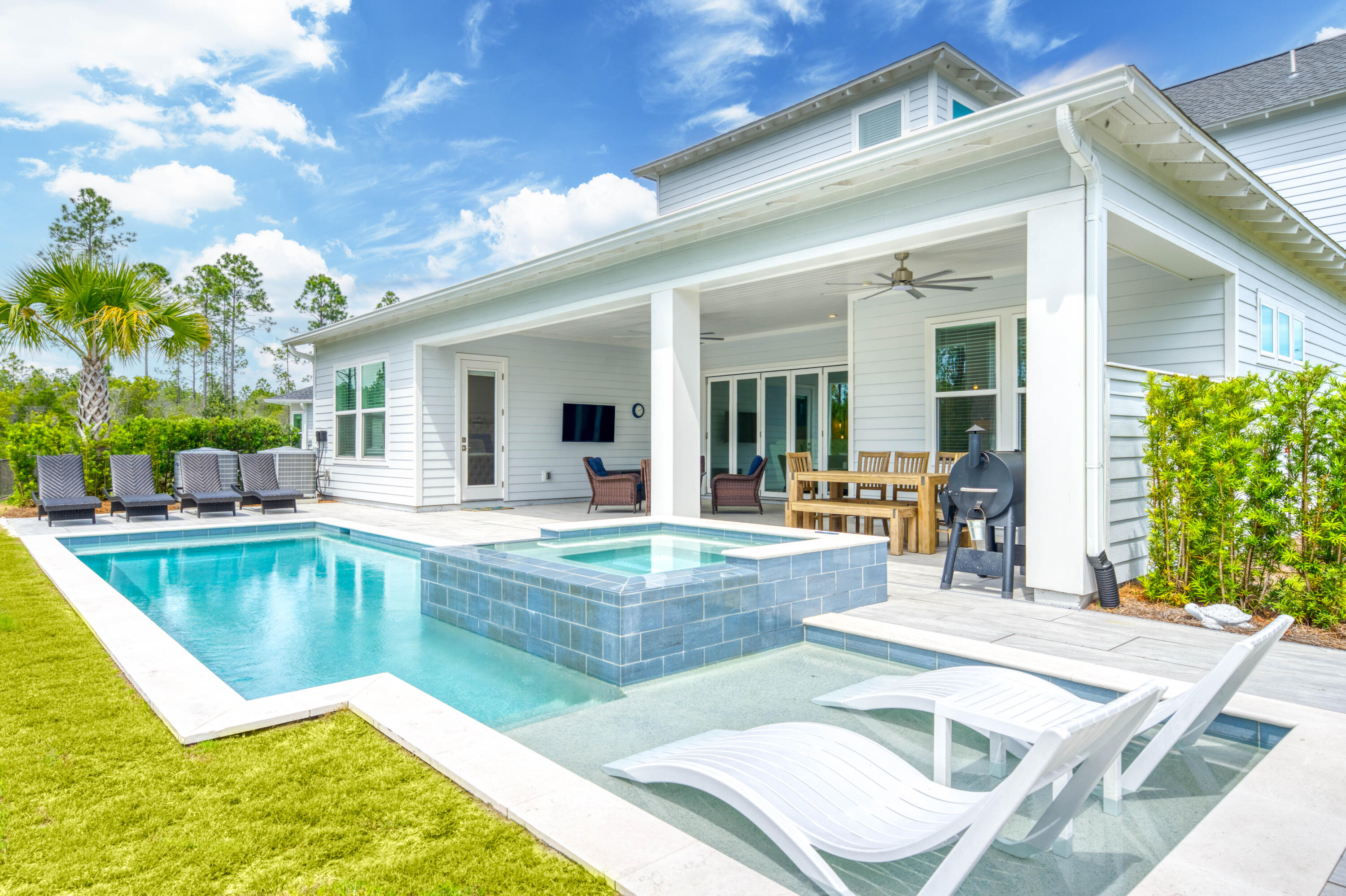 Tucked away on a peaceful cul-de-sac within the gated community of NatureWalk at Watersound Origins, this stunning modern residence is positioned on one of the largest oversized premium lots offering a private oasis for seamless indoor-outdoor living. With a sprawling backyard backing up to a protected preserve, this meticulously maintained 4 bedroom + large bonus room/office, 4.5 bath home features over 4,900 sq ft of thoughtfully designed indoor/outdoor living space with elevated finishes, exceptional craftsmanship, and $350K+ in upgrades, including dual oversize AC units. Expansive 5-panel folding glass doors connect the main living space to the covered patio, outdoor kitchen, firepit, and resort-style pool and spa, while a 3-car garage completes this rare move-in-ready opportunity. Designed for both everyday comfort and elevated entertaining, the open-concept living, dining, and kitchen spaces create the true heart of the home, seamlessly blending refined design with exceptional functionality. The spacious main living area flows effortlessly through five-panel folding glass doors to the extended covered patio, creating remarkable indoor-outdoor connectivity. The gourmet kitchen is beautifully appointed with dazzling quartz countertops, high-end GE Café appliances, including a 60-inch gas cooktop, large island with extra seating space, generous dining space, and thoughtful design touches that enhances both gathering and daily living. The first-floor primary suite offers a private retreat with a spa-inspired bath featuring a soaking tub, oversized multi-head shower, and custom walk-in closet with built-ins. A large bonus room or office, powder bath, and spacious laundry/mud room with sink complete the main level, while the second floor offers three additional bedrooms plus bathrooms and a separate living and entertainment space, providing flexibility for guests, work, or relaxation. Outdoors, the expansive backyard is designed for year-round enjoyment with serene preserve views, a private pool and spa, covered entertaining areas, outdoor kitchen, and firepit.
NatureWalk at Watersound Origins offers a gated lifestyle with access to exceptional resort-style amenities, including community pools, fitness centers, tennis and pickleball courts, walking and biking trails, golf, and access to Lake Powell for paddleboarding and kayaking. Ideally located near Watersound Town Center, Publix, dining, shopping, and the renowned beaches of 30A, this home offers convenient access to the best of the Emerald Coast while providing the privacy, tranquility, and upscale living that define this highly desirable community.