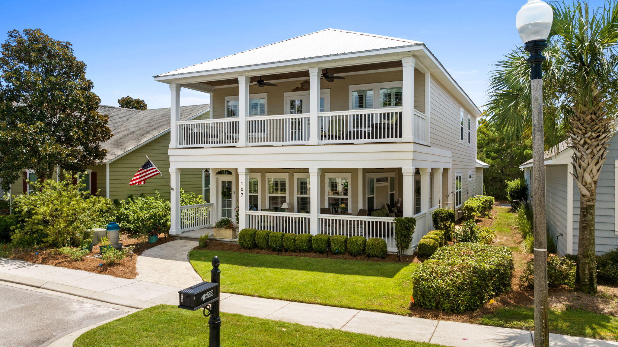Welcome to 107 Turtle Cove, a stunning, custom built 4-bedroom, 3.5-bathroom single-family home located on the west end of beautiful Panama City Beach and 4 miles to 30A. This spacious single-family home offers southern coastal charm and convenience  Lake Powell at Turtle Cove is a highly desirable neighborhood where you can golf cart, bike or walk one mile to the Gulf of America or the local Publix.
Step inside this charming home and be greeted by a bright and inviting interior featuring dual pane windows with plantation shutters and recessed lighting. The large living space is ideal for a family or entertaining.  The open kitchen is a chef's dream, equipped with stainless steel Energy Star appliances and a large island that adds both prep space and functionality. A built-in wine cooler ensures your favorite beverages are always perfectly chilled.
Relax and unwind while enjoying the breezes on the wrap around porches found on the first and second floors. An oversized garage provides ample parking or storage, and there is a large parking pad in back. This home also features a downstairs primary ensuite with double walk in closets. More living space on the second floor has a media/recreation room, offering space for entertainment options along with a pool table, dart board and poker bar included with the home. There are three large bedrooms on the second floor and two additional full bathrooms and large balcony. This home is perfect for a growing family or to welcome family.