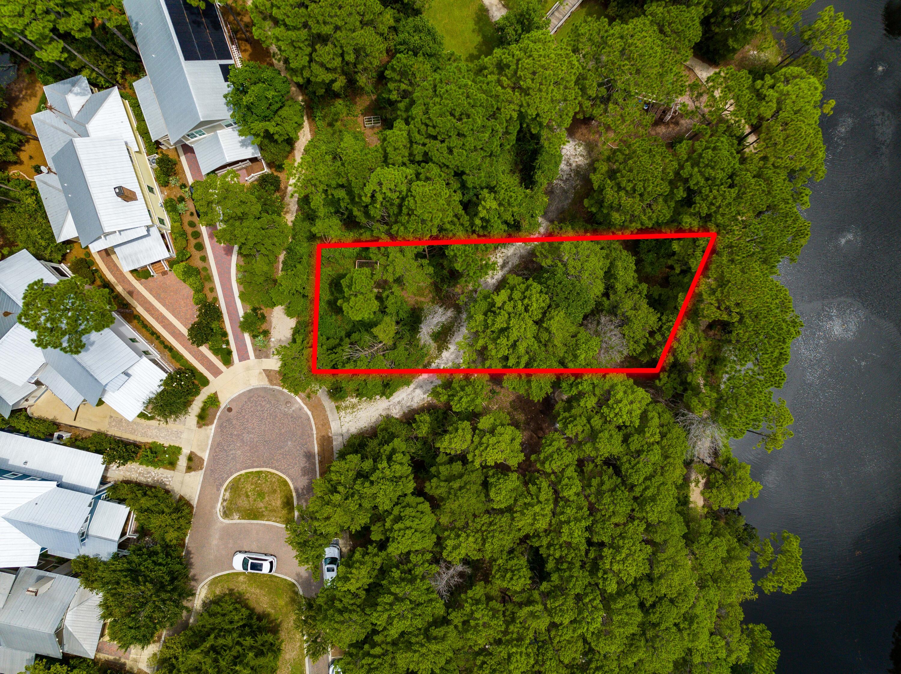 Rare Waterfront Lot for Sale in Forest Lakes | Build Your Dream Home on 30A, Florida.

Opportunity knocks -- and it's sitting on the water. This is the lowest-priced waterfront lot in Forest Lakes, a coveted gated community in Santa Rosa Beach, FL, offering one of the last chances to build your custom dream home with forever lake views from a quiet cul-de-sac setting near Scenic Highway 30A.

If you've been searching for waterfront lots for sale near 30A or the perfect buildable homesite in South Walton, this is the one worth stopping for.

Imagine waking up every morning to the peaceful shimmer of the lake, surrounded by towering native pines and sprawling live oaks -- this is the kind of backdrop that simply can't be manufactured. Forest Lakes is one of 30A's most unique and serene gated communities near Santa Rosa Beach, where nature takes center stage, and neighbors become friends.

A Community Built Around the Good Life

Forest Lakes isn't just a neighborhood -- it's a lifestyle. Spend your days exploring multi-use trails that wind through the natural landscape, casting a line off the picturesque bridge and dock with catch & release fishing, or letting the kids loose at the playground. When it's time to gather, the community pavilion delivers in a big way -- complete with an outdoor grill, sink, generous dining area, and a cozy outdoor living space anchored by a fireplace. All of it looks out over a stunning 2-tiered resort-style pool and lush green lawn. It's resort-style living near 30A without the resort price tag.

A Location That Speaks for Itself

Bordering the pristine Point Washington State Forest and just a short drive to Scenic Highway 30A, you're perfectly positioned to enjoy everything the Emerald Coast has to offer:
Sugar-white sand beaches & emerald Gulf waters
Acclaimed dining, boutique shopping & live music on 30A
Art galleries & entertainment at Gulf Place
Miles of hiking & biking in Point Washington State Forest
Blue Mountain Beach, Santa Rosa Beach & the greater 30A corridor

Why This Lot Stands Out

Lots like this -- waterfront, cul-de-sac, in a gated community this close to 30A -- are genuinely rare in today's market. Whether you're designing your forever home on 30A, a private Florida beach retreat, or a legacy property for your family, this is the canvas you've been waiting for.
Homes and lots in Forest Lakes near 30A rarely come to market at this price. Don't miss your chance to own a piece of one of South Walton's best-kept secrets.

Forest Lakes | Santa Rosa Beach, FL 32459 | Minutes from Scenic Highway 30A & Gulf Place